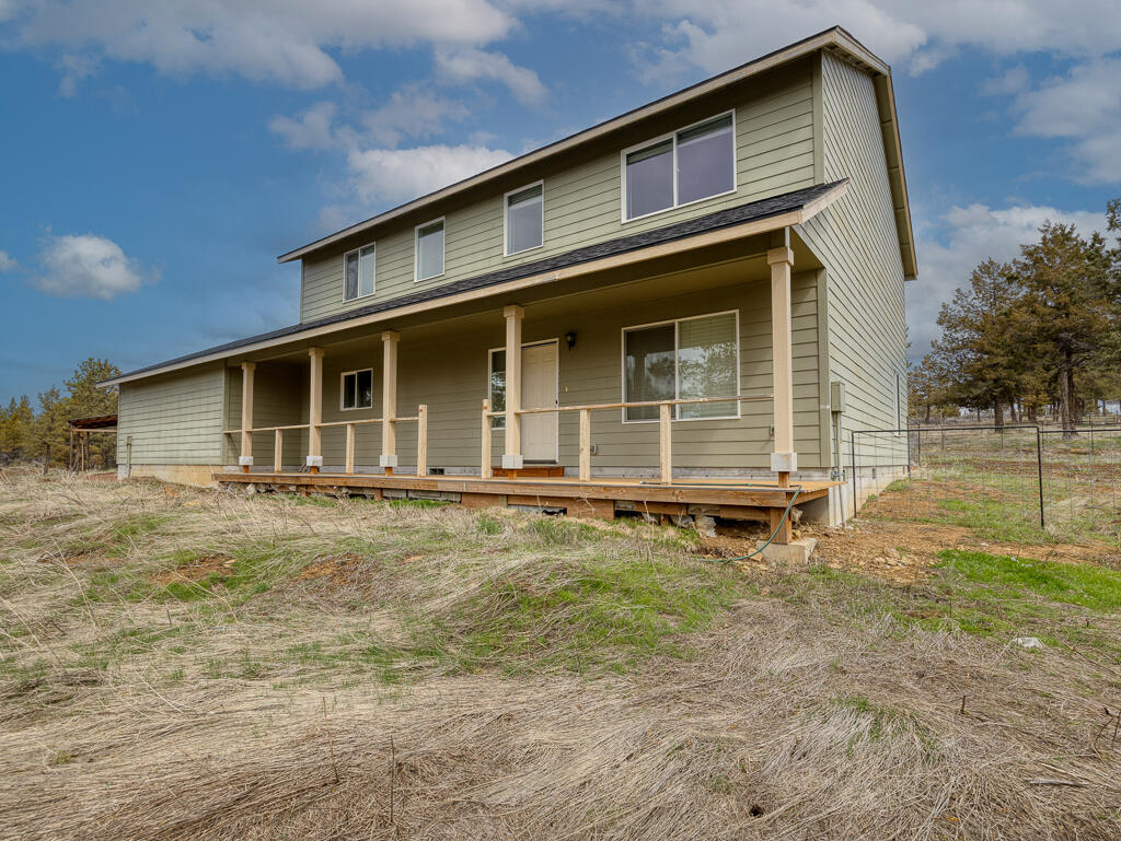 Hard to find acreage. This 4 bedroom 2.5 bath sits on 121.41 acre parcel just outside of Bonanza. The primary bedroom is on the main level. An upgraded new LVP flooring with 22 mil wear rating has been installed. It has a very open floor plan with a huge family room. All the bedrooms are good sized. There is some cross fencing for animals including horse shelters, pig tight pens, farrowing barn and. The property does have an adu hookup. There is a storage shed and covered RV carport. It would almost impossible to put this land, home package together from scratch if you had to buy the land, set up the septic, drill a well and built this house on it. There is area for dry land farming