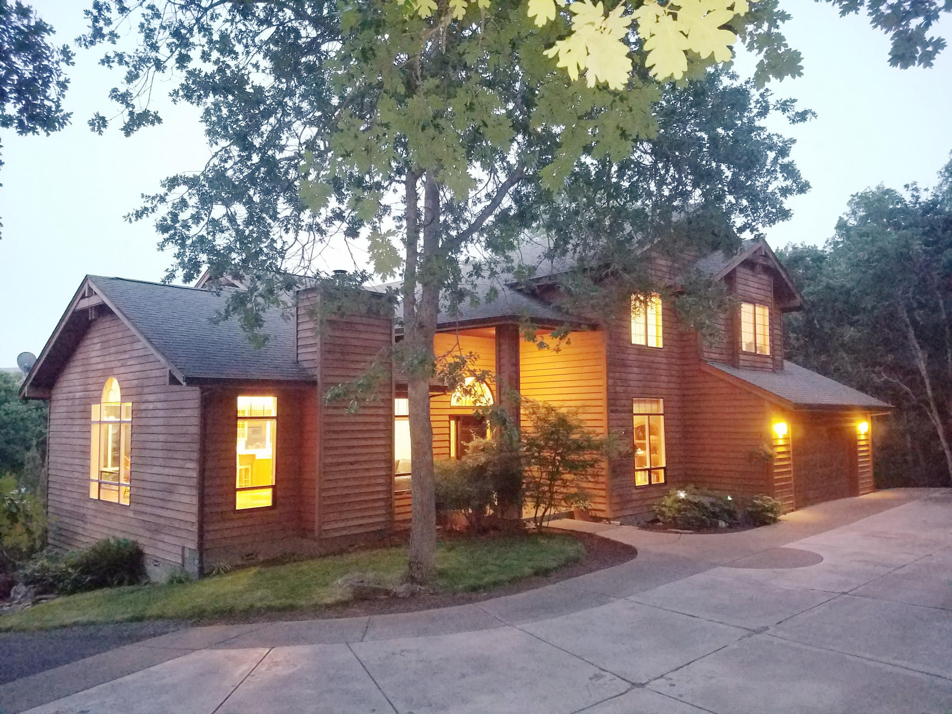Private one of a kind estate on irrigated acreage across from Emigrant Lake with access to water activities & trails. Custom craftsman home with 2 fireplaces, custom cabinetry, exposed  beams, high vaults, tongue & groove ceiling, oak floors, new interior paint, tile, carpet, and new roof 9/2020. Spacious kitchen with eating bar. Partially finished basement for added living. Large windows & expansive decks with nature and mountain views. View master balcony, ensuite bath, soaking tub, dual vanity, walk-in closet. Gated entry, fenced, pond, creek, old-growth and fruit trees, professionally landscaped. Strong well, barn, RV parking, oversized garage. Desirable location close to town and endless recreation. Airbnb potential.