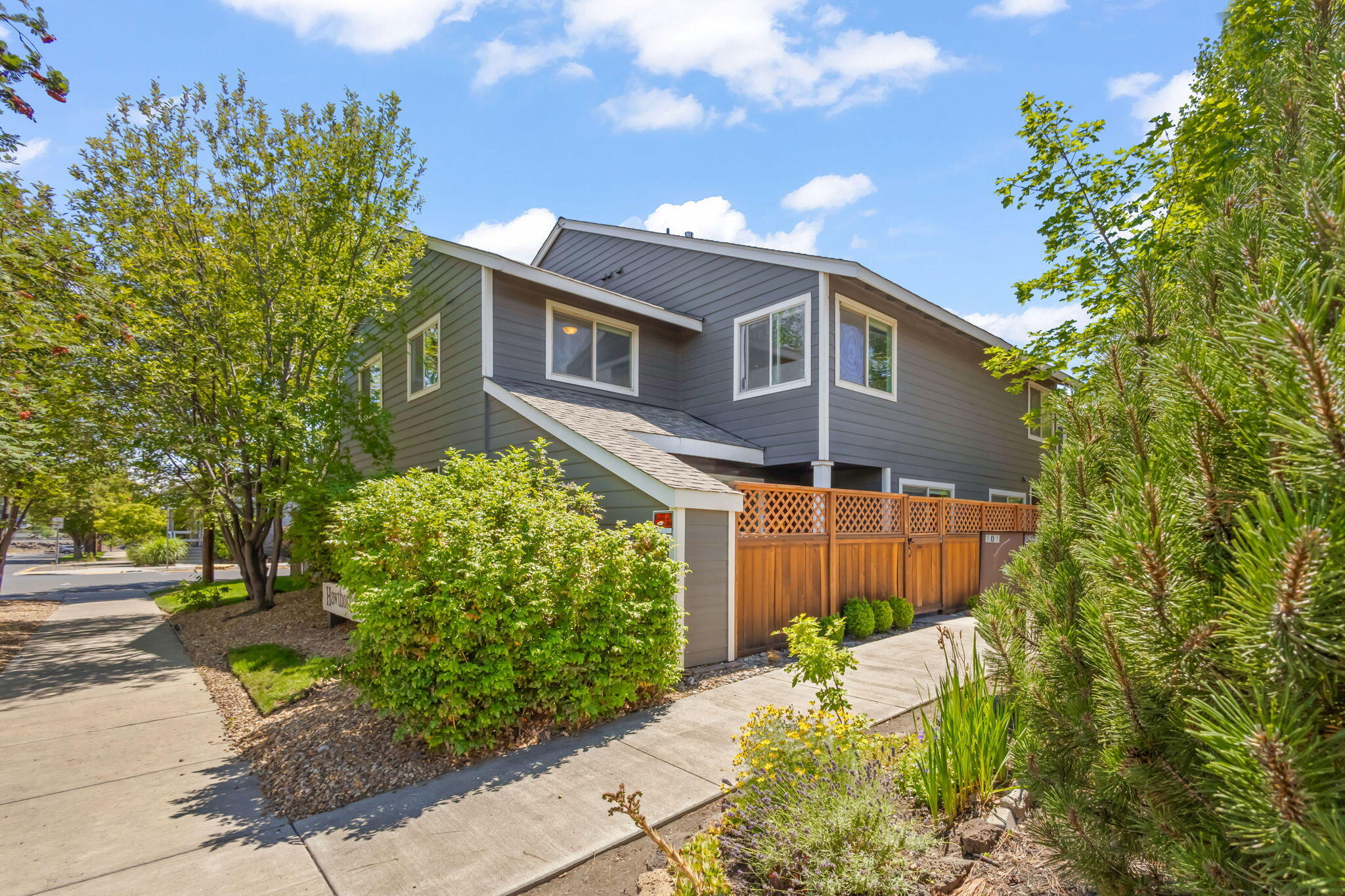 Turn Key! Unbeatable location in the heart of Bend! This updated END UNIT CONDO 2-bedroom, 1.5-bathroom offers the perfect blend of comfort, convenience, and style.  Can be sold with ALL of the furniture! Just steps from the Deschutes River, Pioneer Park, and downtown Bend's shops, breweries, and restaurants, you'll enjoy the best of Central Oregon living. Inside, you'll find tasteful updates including modern kitchen finishes, refreshed bathrooms, new appliances, and stylish flooring throughout. The open-concept living area flows seamlessly to a private patio—ideal for relaxing or entertaining. Upstairs, both bedrooms offer ample natural light and storage. With a well-maintained community, designated parking, and low-maintenance living, this is a rare opportunity for a full-time residence, weekend getaway, or investment. Live where you play—schedule your tour today!