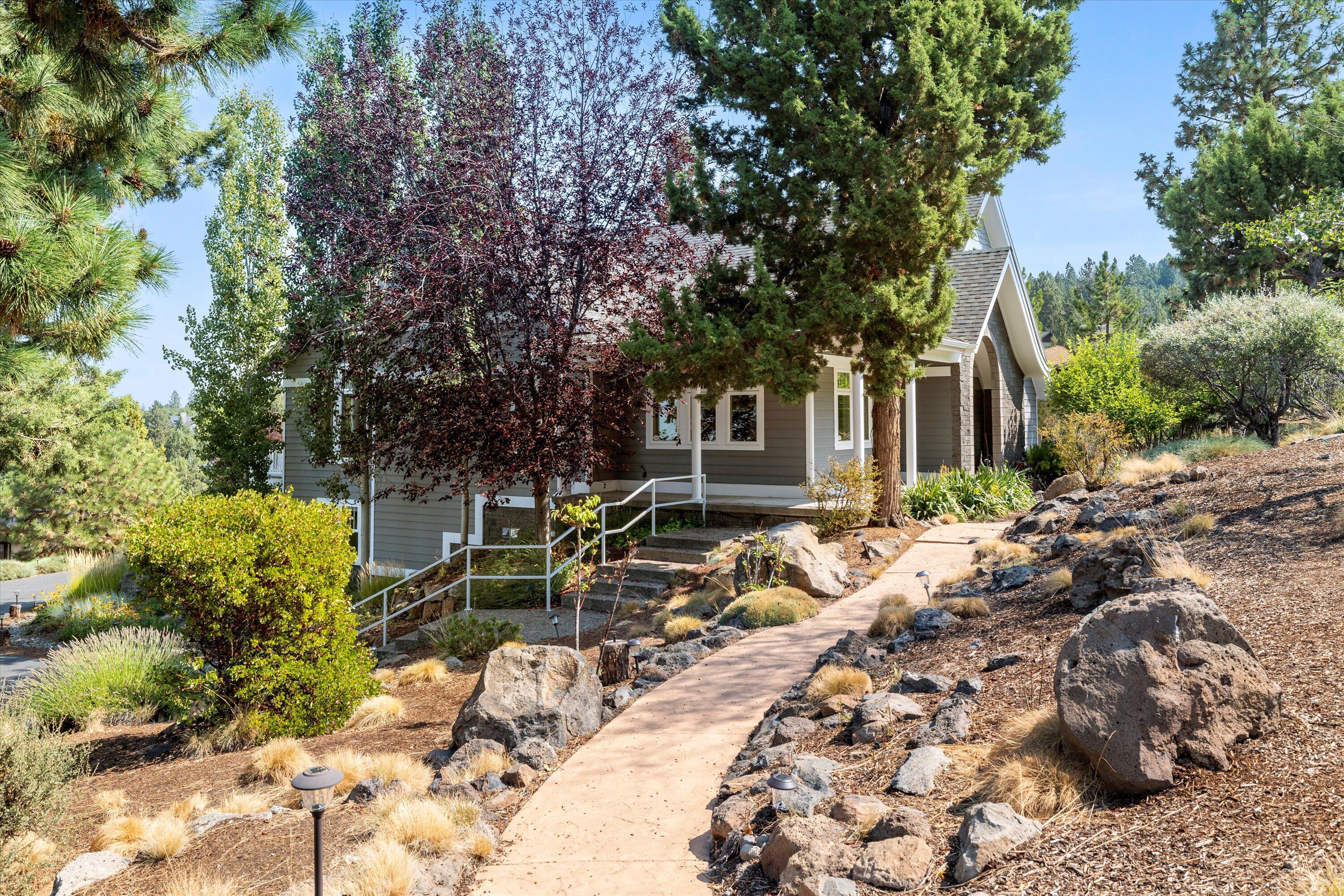 This stunning 4,100 square foot residence boasts  views  of Mt Jefferson and Black Butte and gorgeous sunsets.  The views  will leave you in awe every single day.  An open great room feel welcomes you inside.  The spacious living areas are flooded with natural light, creating an inviting atmosphere perfect for both relaxation and entertaining.  A very special feature is the large office space with glass doors off of the main floor and a private entrance.   The  home has  four generous bedrooms, three have their own private en suite bathrooms, ensuring everyone has their own personal retreat. The primary suite is a true sanctuary, complete with two spacious closets and a spa-like bathroom for ultimate relaxation. The large upstairs bonus room is adjacent to a full bath and the 4th bedroom.  The gourmet kitchen is a chefs delight, equipped with modern appliances, Corsica quarts counters and a charming breakfast nook.  The large fireplace in the living room is inviting and warm.
