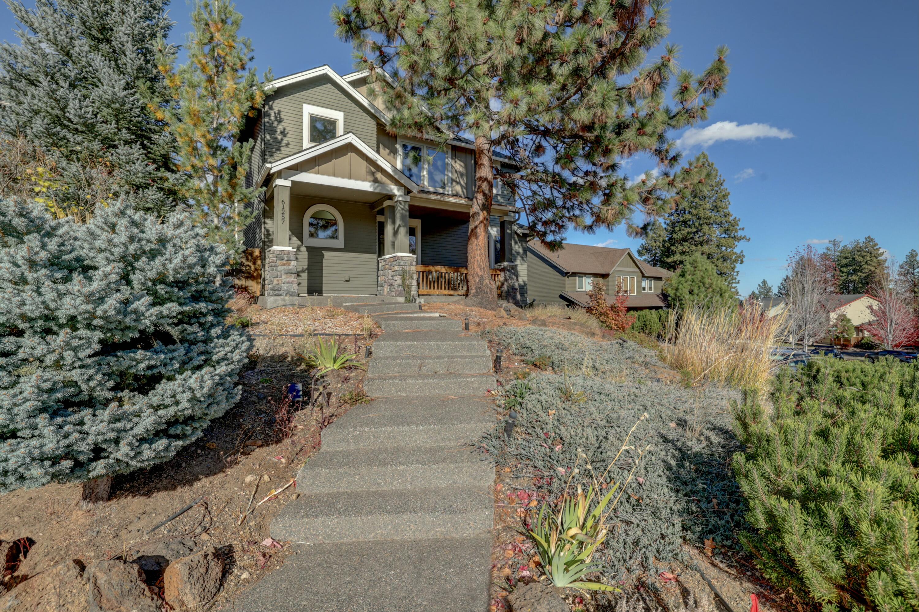 ''Discover charm & investment potential in this 2500 sqft, 4-bed, 4-bath home with a 550 sqft ADU in Bend. Wake up to sunshine in this inviting home elevated above the street on the largest lot. Enjoy a prime location near the vibrant 'Old Mill District', concerts by the river, and miles of trails. Inside, find bamboo floors, stainless steel appliances, tile, quartz, and hickory cabinets. The main floor primary suite offers convenience, while the en-suite and Jack and Jill style private bath cater to comfort and privacy. The versatile loft/flex space is perfect for a game room, office, or family area. The private yard extends into additional easement area, providing ample space for parking or RV storage. The ADU offers privacy and rental income potential. With RV parking and room for expansion, this home has it all. Don't miss out on Bend's best buy - experience the unique charm and value this property offers!  Possible seller terms as a lease purchase....