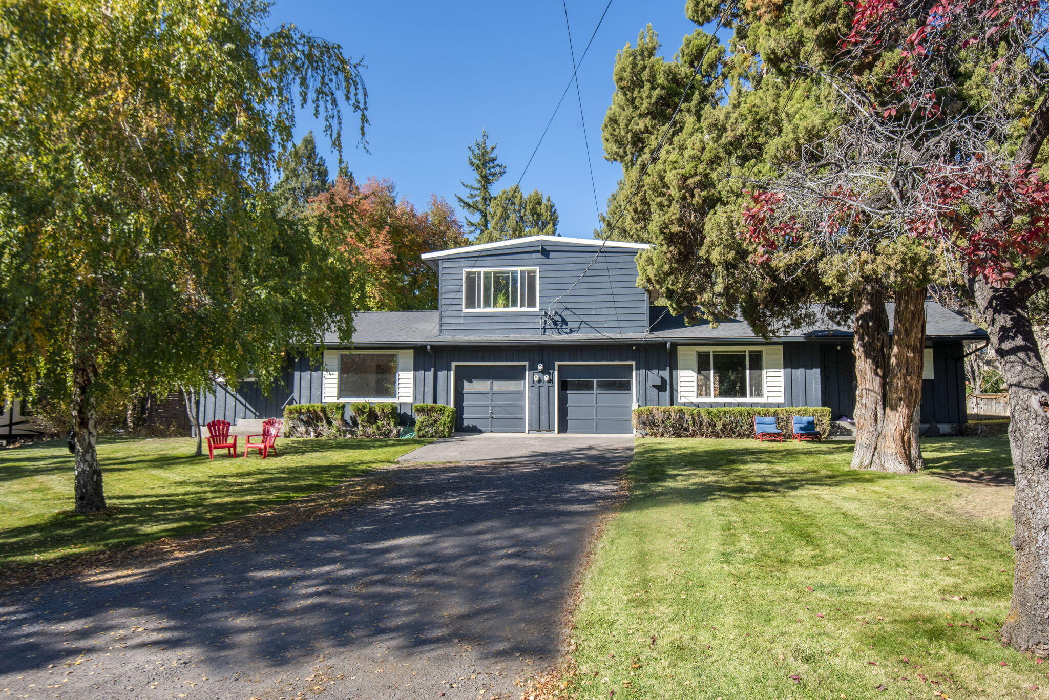 Great Investment Opportunity on Bend's West Side....Location, Location, Location! This charming, well-maintained Triplex is on a large lot, in an established neighborhood on Bend's desirable west side, blocks from the Newport corridor filled with restaurants, coffee shops & shopping, the Deschutes River, 1 mile from Bend's historic downtown & near COCC & OSU Cascades campuses.  All 3 units are currently rented and the property has a long & strong rental history. The recently rented 2 bedroom unit was just updated with new paint, flooring in the kitchen & bathroom & a new bathroom vanity. Both lower-level 2-bedroom units have in-unit laundry & each has a garage with storage. The upper-level 3rd unit is a 1 bedroom.  New exterior paint in 2023, and roof in 2021 among many recent upgrades. Potential to add a 4th unit per the county. Buyer to verify. Shown by appointment only.