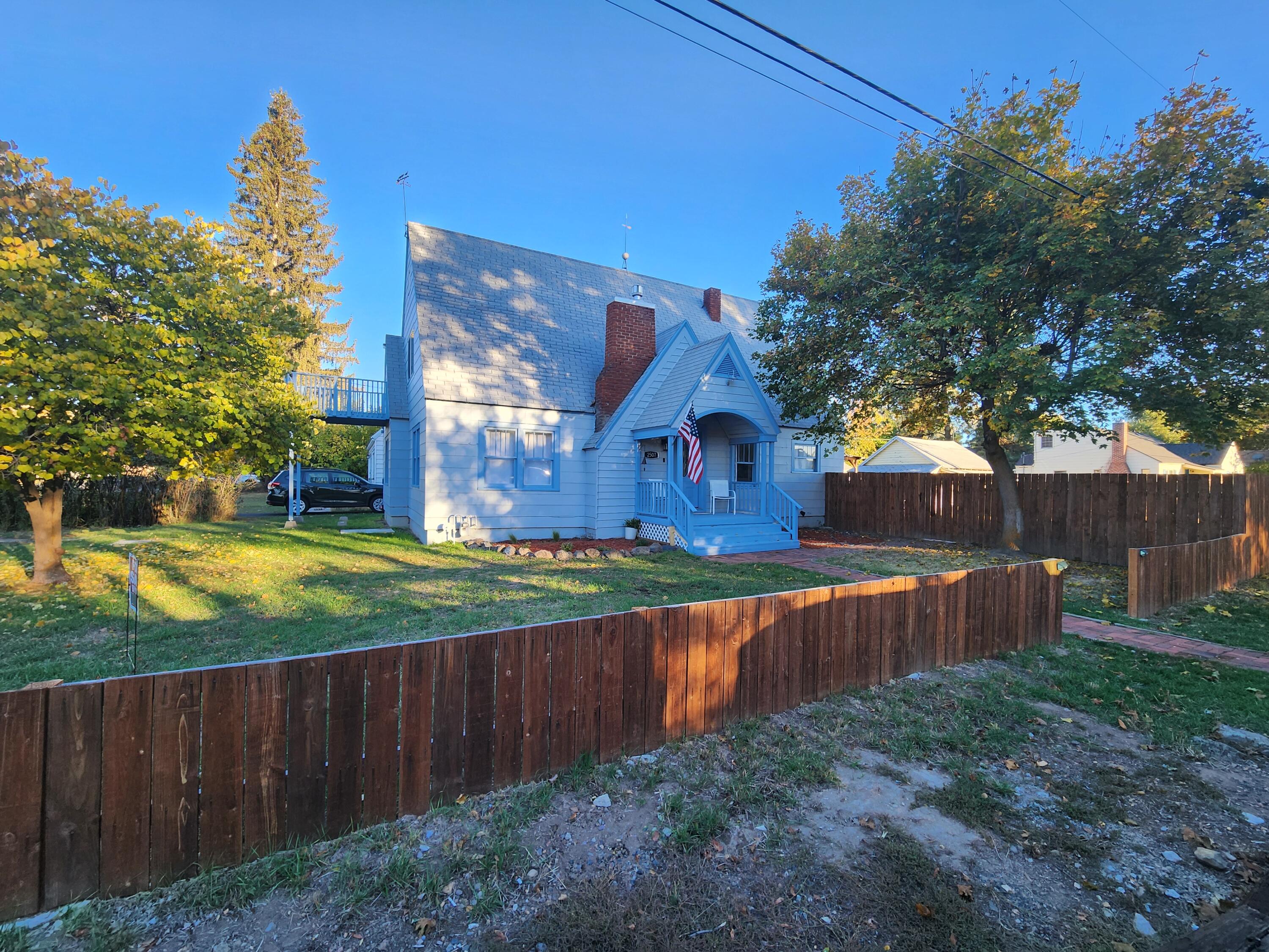 Beautiful 3 bedroom, 2 bathroom home on a large corner lot. This home is no cookie cutter- with the arched doorways and built ins through out. The living room features a gas fireplace, two large bedrooms and a bath on the main level with formal dining, an office space, and a well lit kitchen. Off the kitchen is a mud/laundry room that leads to the fenced yard. Plus, a large redwood deck with covered pergola, providing great shade for BBQing and relaxing on warm sunny days. Upstairs has a bonus room with huge primary bedroom featuring vaulted ceilings, private balcony, and bath. The basement has a perfect room for those who like to can and prepare with excellent storage! This home is ready for you to make it your own.