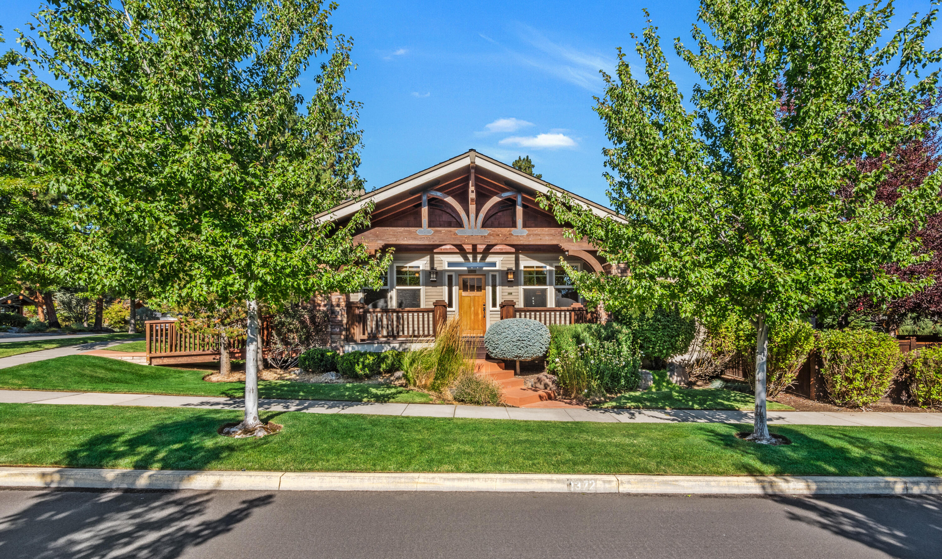 Welcome to this well-maintained single-level Craftsman home in the heart of Northwest Crossing, located on the corner of NW Cruzatte Ln and NW Dorion Way. This home offers southern exposure and territorial views. The front door provides a wheelchair runway and a covered front porch. Inside, you'll find vaulted ceilings with exposed wood beams, creating a warm and welcoming space. The great room floor plan is flooded with abundant windows and natural light. The home features built-in shelves, newly refinished hardwood floors, wood wrapped windows and doors, and knotty alder cabinets. The primary suite offers a walk-in closet, shower, and separate soaking tub. Additionally, there are two bedrooms, a laundry room, a formal dining area, a pantry, and a dining nook. The corner lot boasts mature landscaping, privacy, and alley access. It's conveniently located near Lewis & Clark and Compass Parks, High Lakes Elementary, and all the shops, restaurants, and amenities in Northwest Crossing.