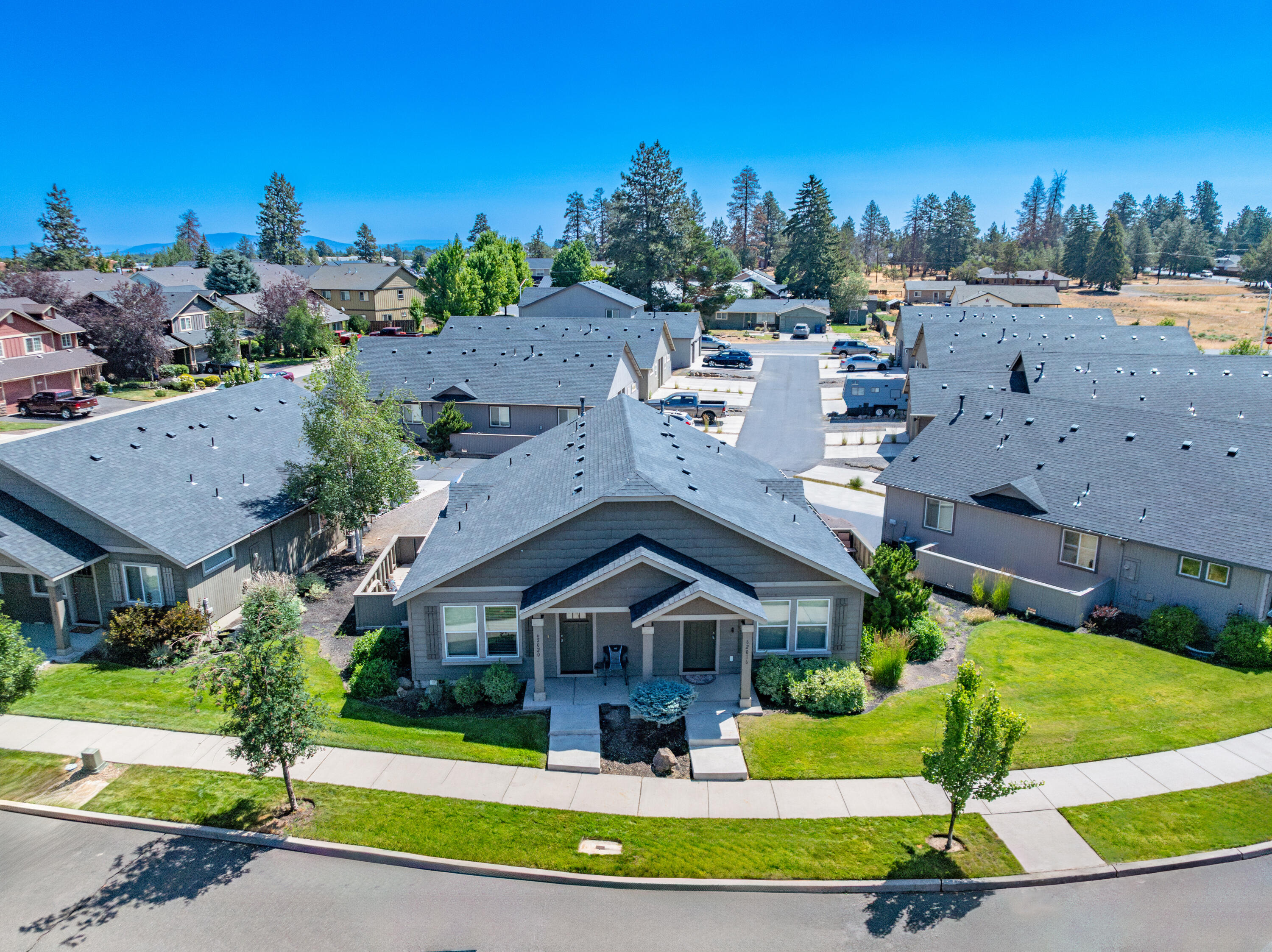 Discover the allure of Clarendon Place, where quaint charm meets modern living in beautiful Bend, Oregon. Nestled on a serene, quiet street, this 880-SF floorplan features a welcoming entry into the open living area, functional kitchen, 2 bedrooms w/ substantial closets, & laundry room. Conveniently located near Pilot Butte, midtown, & East Side shopping, Clarendon Place ensures easy access to everything Bend has to offer. Imagine living just moments away from outdoor adventures & urban conveniences alike. Don't let this opportunity pass you by—visit Clarendon Place today and envision your new beginning in Bend's most desirable subdivision. Seize the moment. Embrace the lifestyle. Welcome to Clarendon Place.