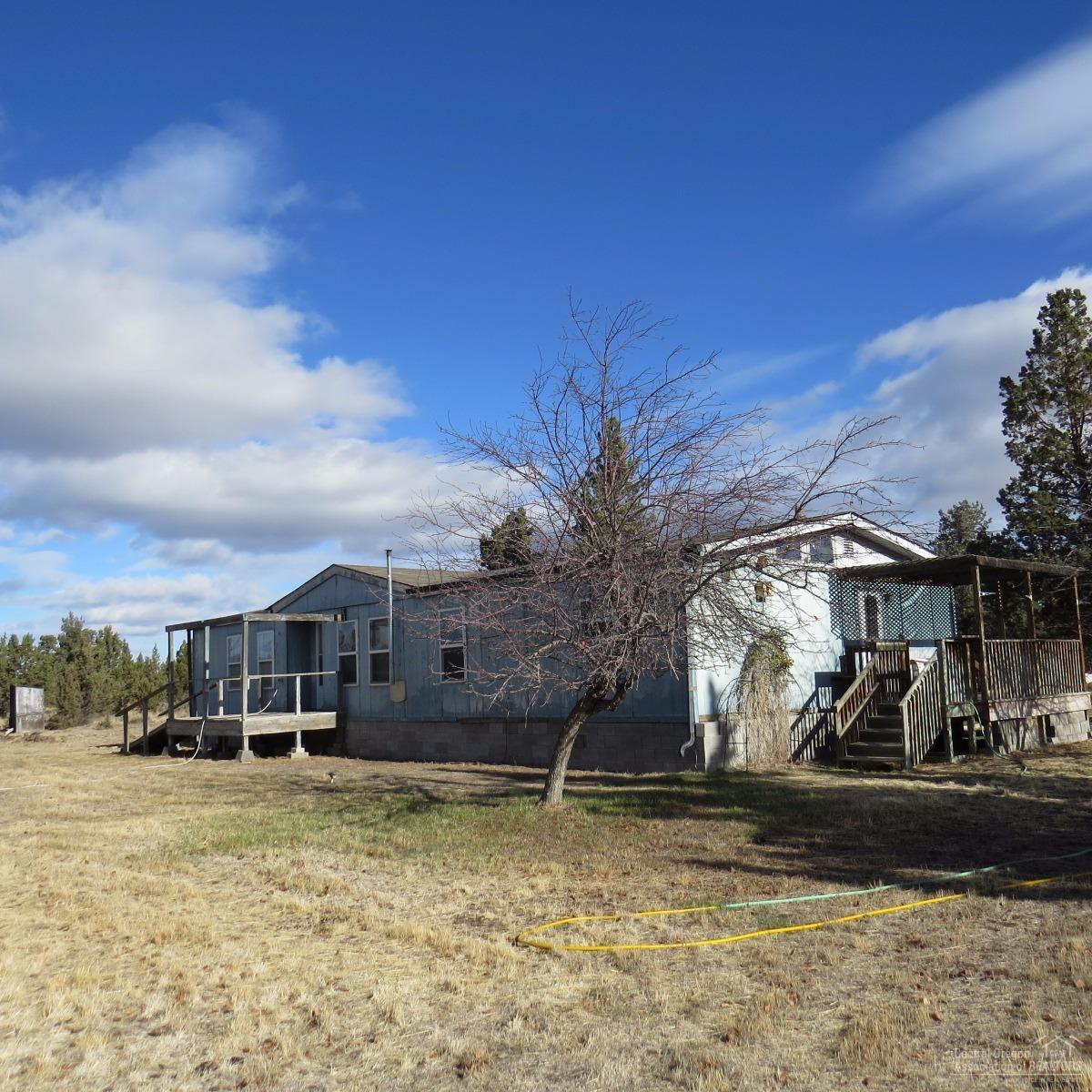 Investors here is a 3 bedroom 2 bath Sequoia Manufactured home on 5 Acres in Crooked River Ranch, 1512 Sq Ft. Open floor plan. Range, Refrigerator, Garden area. Private well. Room for a horse. Golf Course and many other amenities in this subdivision.