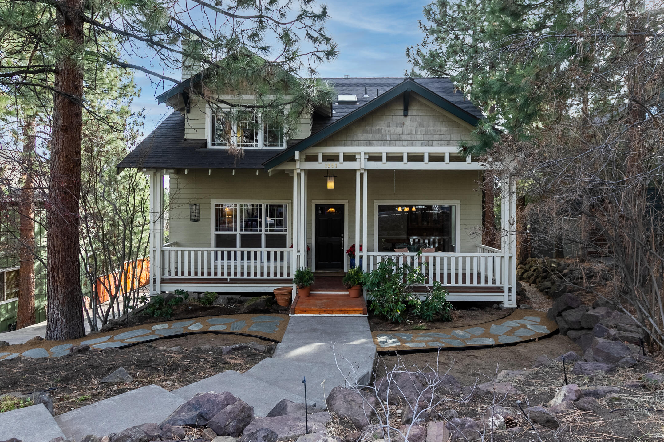 Rare find in prime Westside Bend location! Fabulous custom home located in the desirable Golden Butte neighborhood in the heart of Bend! This 4BR/3.5BA home features a dream chef's kitchen with cherry cabinets, granite counters and walk-in pantry. Beautiful quality hardwood flooring and woodwork throughout. Upstairs: Primary Suite w/ private balcony, 2 additional bedrooms and full bath. Downstairs: Private Guest Suite has a full bath, kitchenette, radiant floor heat and its own entrance. Garage is set up w/workshop space and plenty of storage. New roof in 2019 w/heat pads installed. Enjoy space and tranquility on your private .26 acre south facing, fully fenced backyard w/established fruit trees and raised garden beds. Walk or bike to schools and Westside amenities. Home is STR eligible per City of Bend.