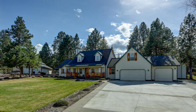 Home, Shops & Pro-Barn Horse Property on 2.5 Acres in SE Bend! Wonderful home in the Woodside Ranch area, but without the HOA! This 2755sf home features: Beautiful covered entry porch w/log accents, extensive ¾ inch HW Oak flooring, large living room w/gorgeous river-rock gas fireplace & log mantle, office w/log surround entry & HW floor, spacious dining/kitchen area w/Bay-Window, granite counters, granite island/B-Bar, Wolf cook top, pantry, Vaulted main-level Master Suite w/sitting area, big walk-in closet, dbl granite vanity & large tiled shower, big back deck, Huge attached 1036sf 3+ car garage is finished/insulated, detached 20x40 RV garage/shop w/14' door & full RV hookup, detached 4th 18x20 Garage/Shop + 36x38 3-stall Barn w/private pasture, tack room, pull-thru roll up doors, auto horse waterer & 12 ton hay storage! Newer upgrades include Roof & Paint (home & shop) in 2020 and new cement driveway in 2021!
