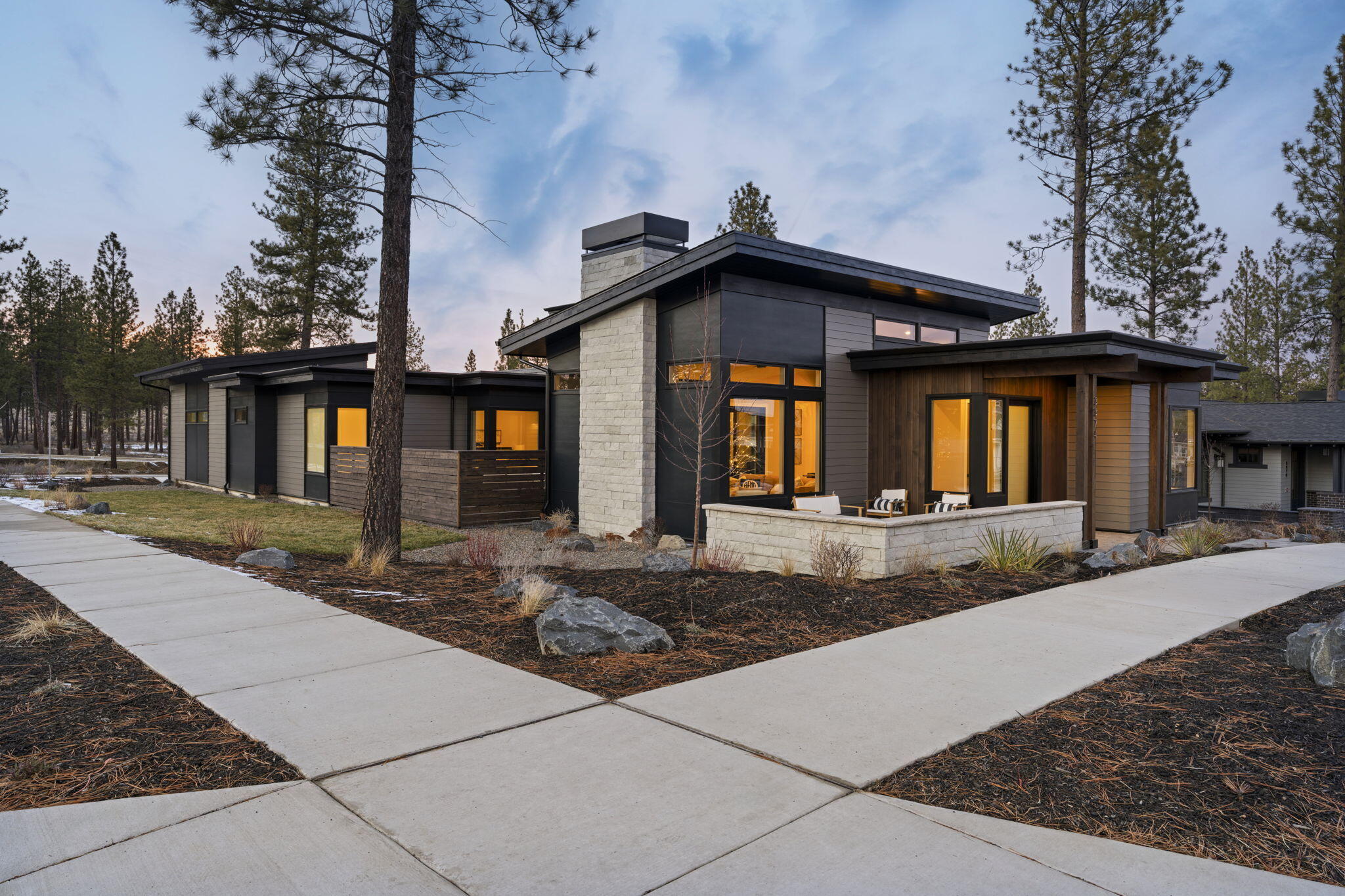Experience modern luxury in this stunning 4-bedroom, 3.5-bath, 3,240 sq. ft. two-story residence by Luxe Homes. Designed for both elegance and versatility, the home features a dedicated living wing with full bath, kitchenette, and laundry—ideal for guests or multigenerational living. The open-concept main level seamlessly connects the living, dining, and kitchen spaces, complemented by a private office and a serene, luxurious primary suite. Upstairs, a bonus room provides flexible entertainment or leisure space. Contemporary finishes throughout and thoughtful design elevate every room, while a three-car garage with a sprinter bay ensures ample storage. Two beautifully appointed courtyards/patios create perfect spots for relaxation or entertaining. A sophisticated, functional haven built for modern living in Discovery West. Builder is in the process of extending the fence to encompass the side yard.