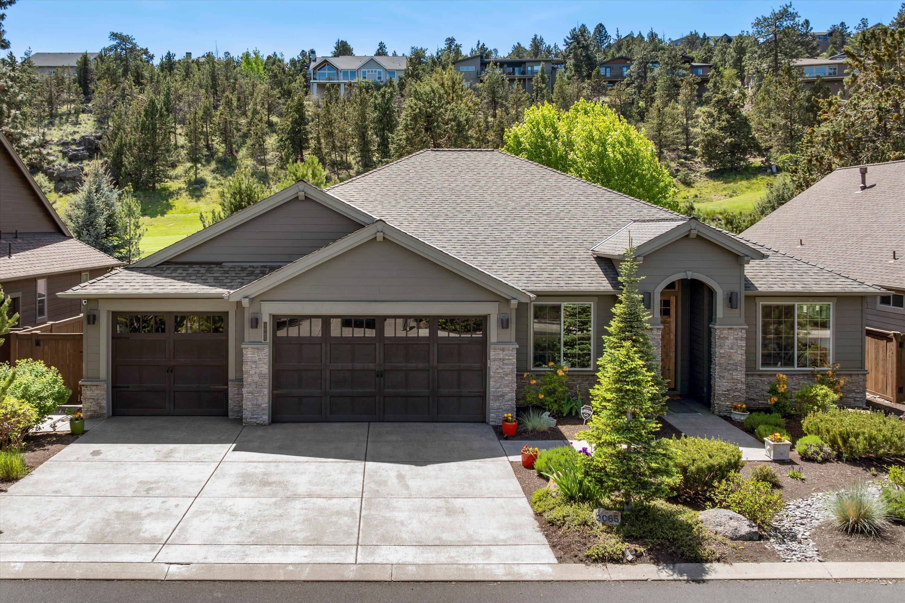 If you are looking for the perfect home look no further! Nestled in the coveted River's Edge community this exceptional home offers refined living in a serene, golf course-adjacent setting. A blend of Northwest charm with traditional design, the open-concept floor plan boasts a gourmet kitchen with high-end appliances, a large center island, breakfast nook and formal dining. An abundance of beautiful cabinetry throughout. The adjacent great room is centered around a gas fireplace. Natural light streams in! The master suite provides a private retreat with a luxurious en-suite bathroom and walk-in closet. Two additional bedrooms, each with a full bathroom and a private office complete this easy living floor plan. The fenced private backyard features a covered patio, ideal for outdoor entertaining. Direct access to the Deschutes River Trail, offering scenic views and recreational opportunities. A gated community with low-maintenance landscaping and great proximity to shopping and trail!