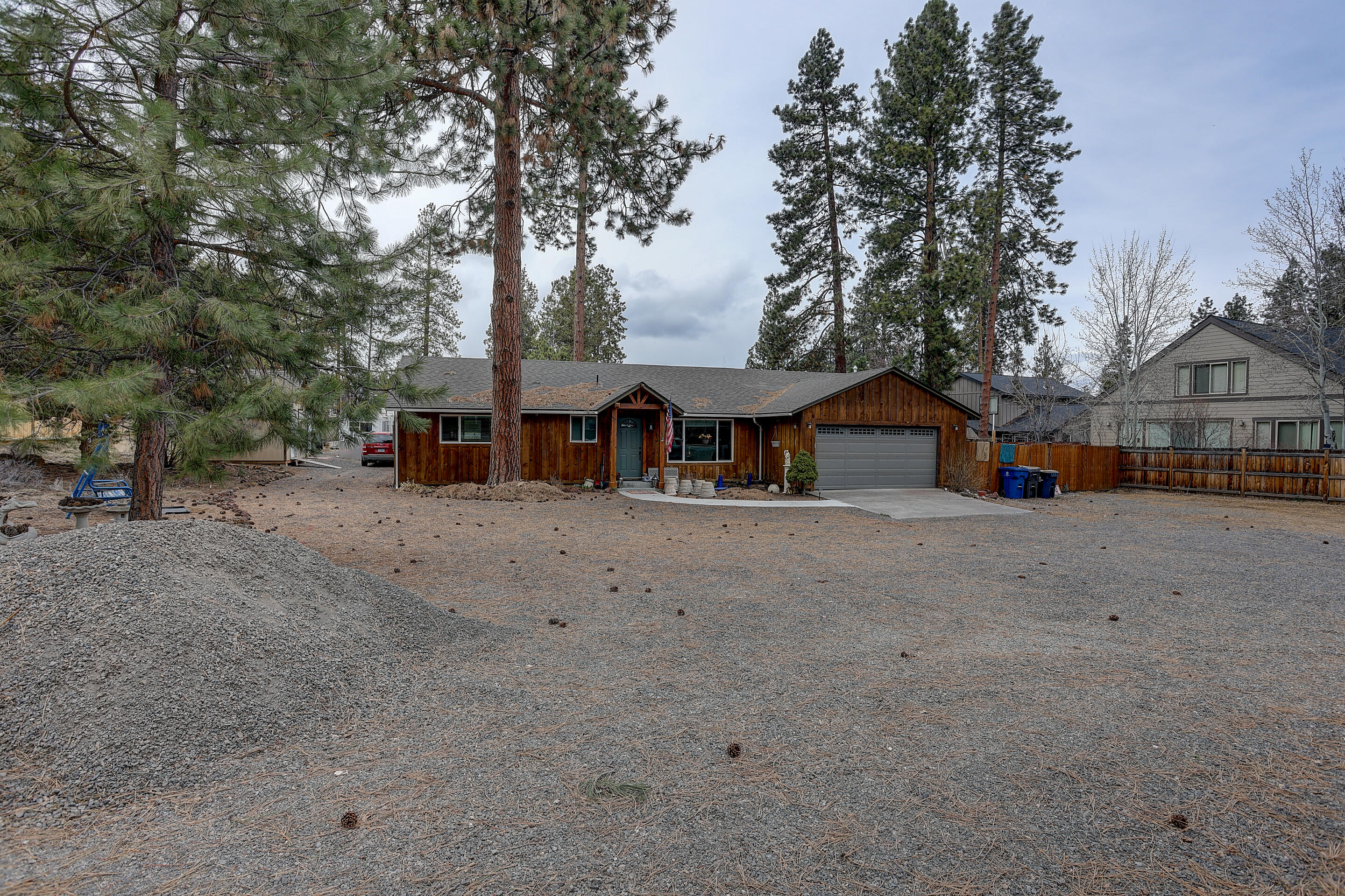 Short term rental permit approved for existing home, Tentative proposal approved for 6 SFR homes, approved plans and permit to expand existing home by nearly 25% and have a Bend City approved ADU, plus RV pad with power. The existing 1400 sqft home has a fresh remodel which includes new cabinets (not refinished, new) and upgraded appliances fully updated bathrooms, new carpet in the bedrooms, new furnace and air conditioner. Water and sewer have been tied in to the city in 2022. Collect significant rent from both the existing home and the RV space that has 50 amp service,50 gallon propane, and clean-out, and it still gets better; the city has approved a carve out for a tiny home that can be split off the SE corner of property on completion of the subdivision. Seller has put much towards building out the 6 SFR's and is moving forward. Price based on where the project stands today. Tractors can be moving dirt this summer. Agent is related to Seller and has share.