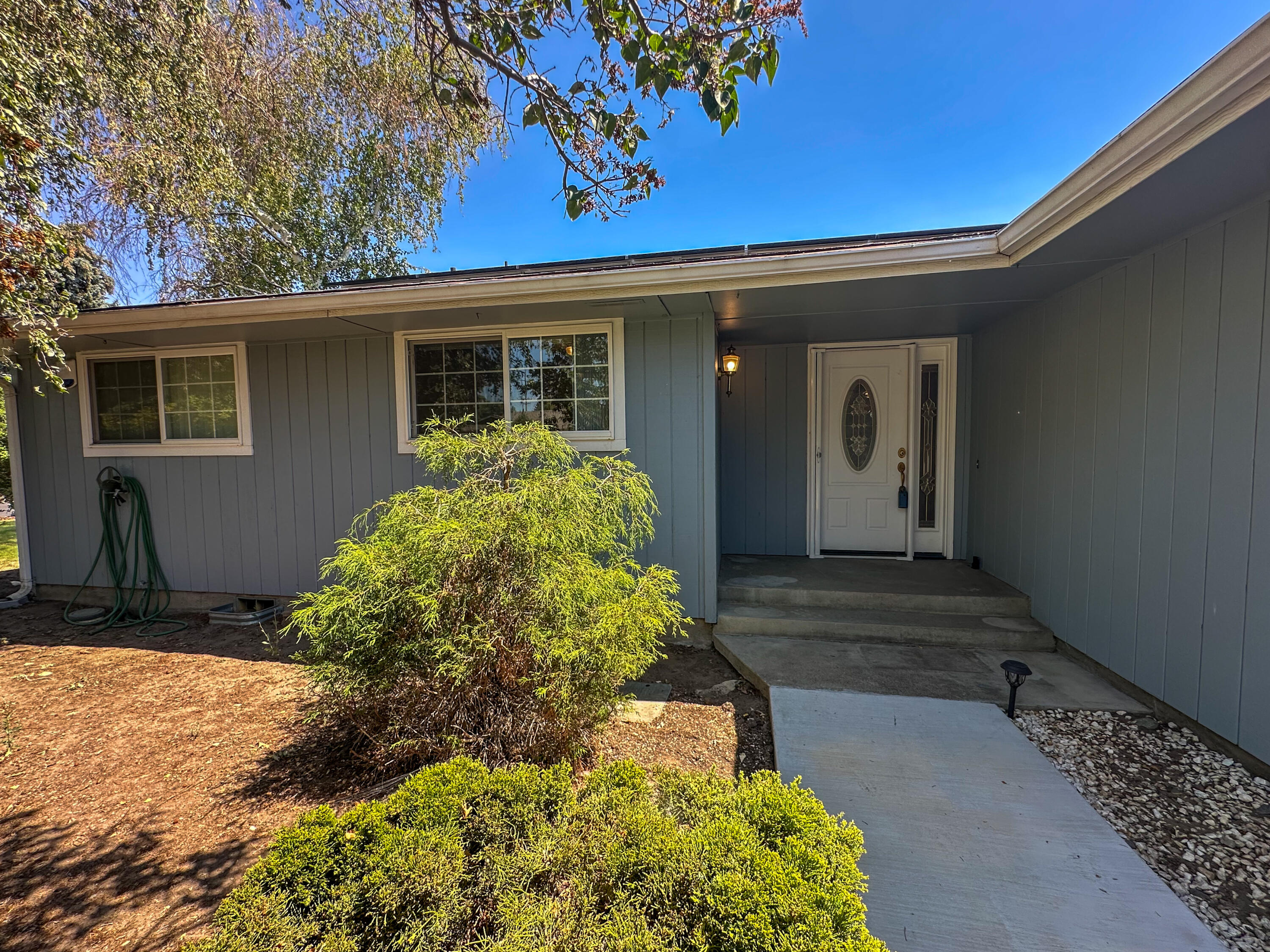 Seller is taking back up offers! Welcome to this single story Gatewood home in Oregon's ''City of Sunshine.''  Eco friendly solar panels currently keep average power bill under $20/mo.  Open concept with inviting fireplace.  3 spacious bedrooms plus versatile bonus room.  Fully fenced backyard with patio and fenced RV pad.  Established landscaping with timed sprinklers. New furnace and air conditioner installed June 2025.