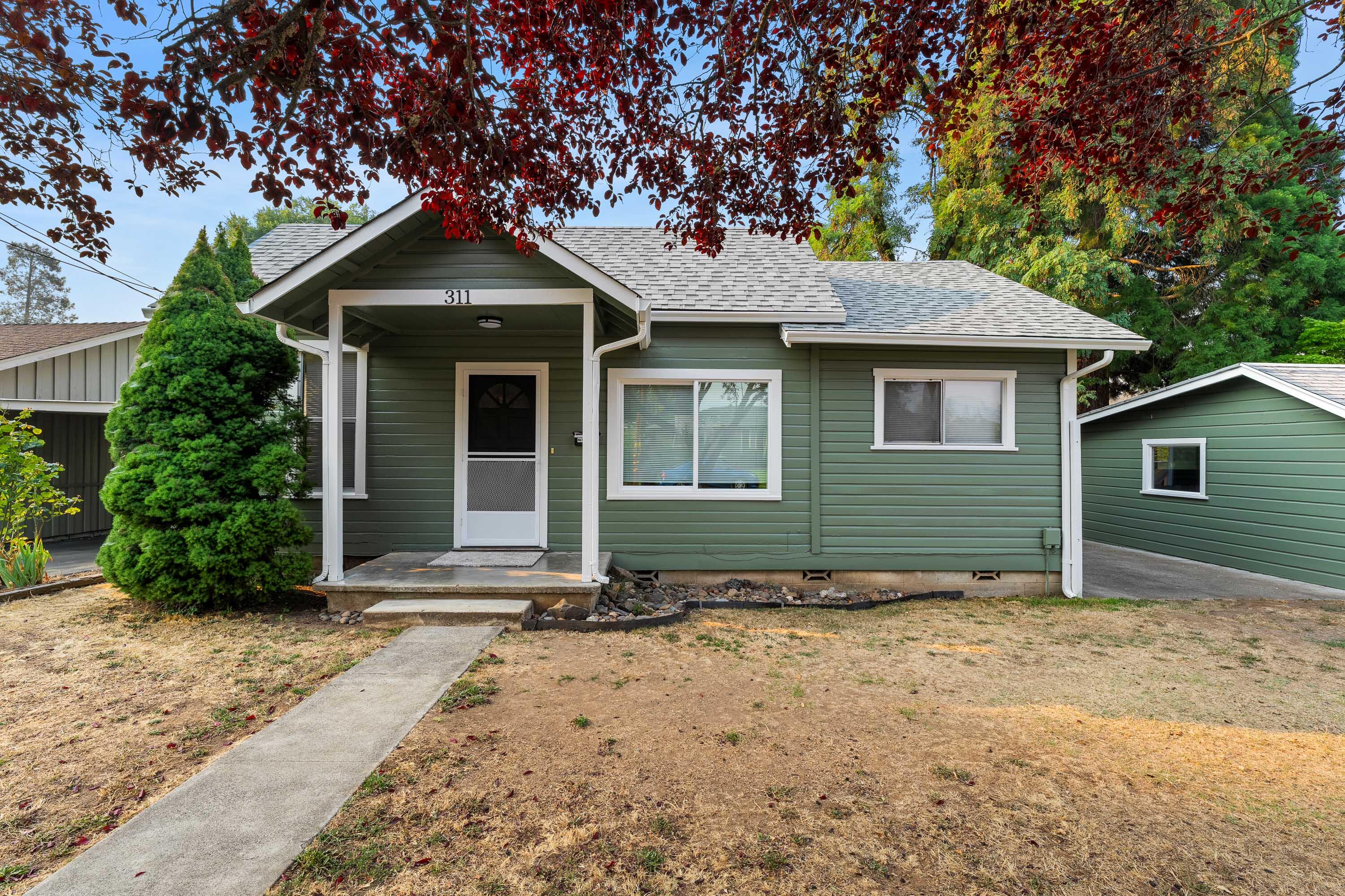 This charming 3-bedroom, 2-bath home has been thoughtfully updated with a brand-new roof, fresh interior and exterior paint, new carpet, updated lighting with chandelier, a new living room window, and two ductless air units for efficient year-round comfort. The practical floor plan includes a kitchen overlooking the fully fenced backyard and a welcoming porch for outdoor enjoyment. Offering 992 sq. ft. of comfortable living space on a low-maintenance .11-acre lot, this move-in ready home is an excellent opportunity for first-time buyers or investors seeking a rental property.