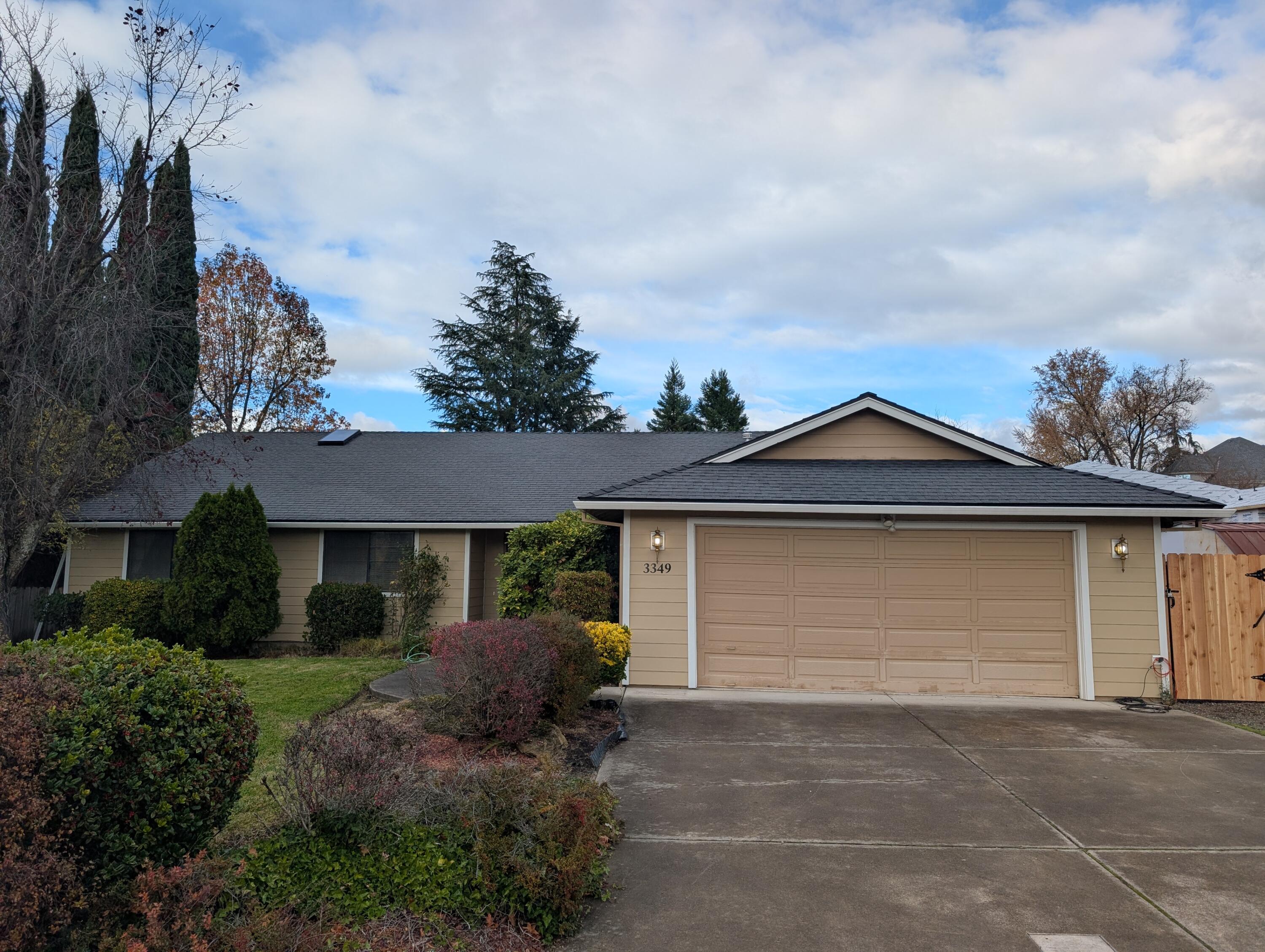 This East Medford home boasts 1,880 sq.ft. with 3 large bedrooms and 2 full bathrooms. Sitting on almost 1/4 acre lot, it has RV parking and an in-ground swimming pool. The living room is large with a brick, wood burning fireplace. There is a large kitchen with plenty of cabinets and counters with a built-in island/breakfast bar. A separate dining room and an eating area are on both sides of the kitchen. The primary bedroom is very large as well as the primary bathroom. This home has RV parking, landscaping, and an in-ground pool. Also, you can find a patio outside the sliders off of the dining room. The home has tremendous potential but does  need updating. Located in a very desirable area.