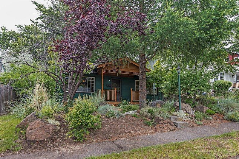 This American Craftsman Bungalow style, built in 1950, represents its classic Bend, Oregon roots beautifully. Clean lines & decorative arts style from the covered front porch to the integration of the kitchen into the main living area. Close to down town. Mature trees, deck, generous backyard w/upper terrace and alley access. Newly painted inside. Original hardwood floors. Composite roof in 2010. Vinyl windows. Vermont Castings gas stove.
