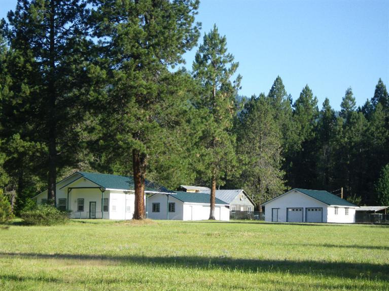 Very unique property, 7.13-acre pasture and timber setting, all fenced, zoned UR-1, partitioning is possible. Top quality workmanship compliments all structures, two garages with shop area, full double RV pad. Home is only 1-bedroom but could easily be added on to. Good well per owner. Must tour to appreciate. Seller is putting up new solid board fence on the driveway entry (to be installed 2/9/16).
