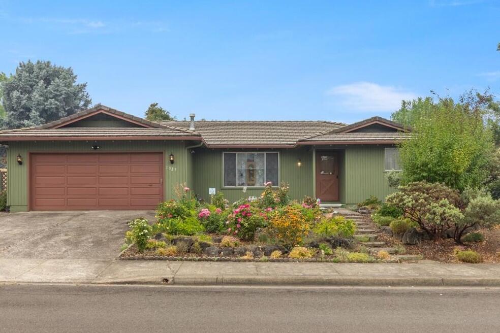 This beautiful gem is located close to Providence Hospital, transportation and shopping. It has had the same caring owner for the past 32 years. The sought after floor plan, includes living rm. with gas stove, family room, with fireplace. and wood insert, new wood flooring, low maintenance landscaping, lifetime tile roof, RV parking, fruit trees, grapes, water feature, double garage and much more. This property will sell fast, so make an appointment today