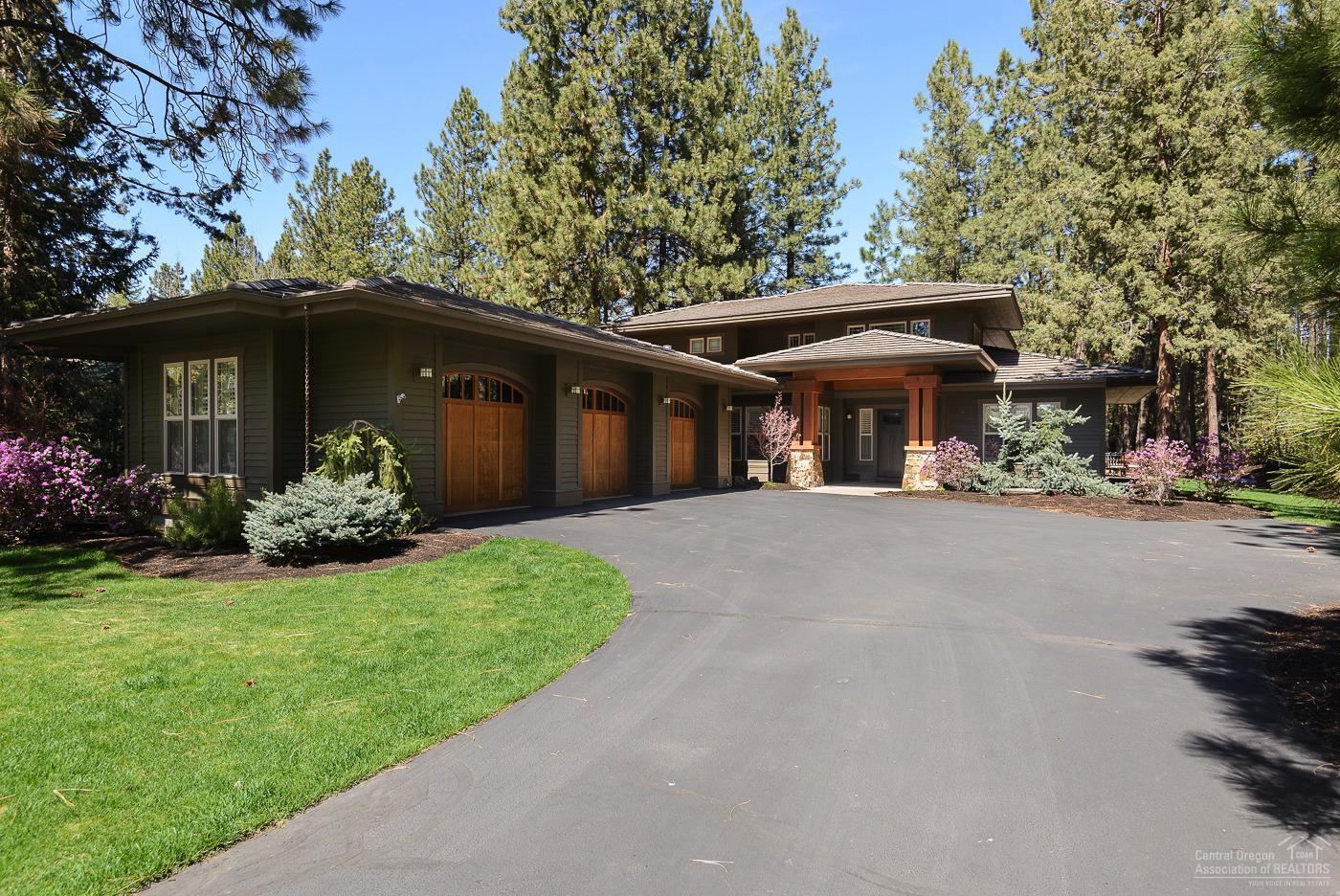 Stunning remodeled home in Broken Top. High end finishes, custom cabinetry and solid surface counter tops throughout. Open floor plan featuring great room with gas fireplace, gourmet kitchen, dining area, guest suite and den on the main level. Master suite on main level with gas fireplace, outdoor access and spa-like bathroom boasting a large tile shower and free standing soaking tub. Two bedrooms, full bath and bonus room on upper level. Wine closet with refrigerator. Laundry room and mud room with custom built-ins. Surround sound inside and out. High efficiency heating and cooling as well as electric radiant floors in master suite bath, guest suite bath, laundry room and mud room. Two covered patios in addition to a large paver patio with gas fire pit and hot tub for outdoor living. Oversized 1,108 sq ft triple-car garage. Beautifully landscaped and private yard.