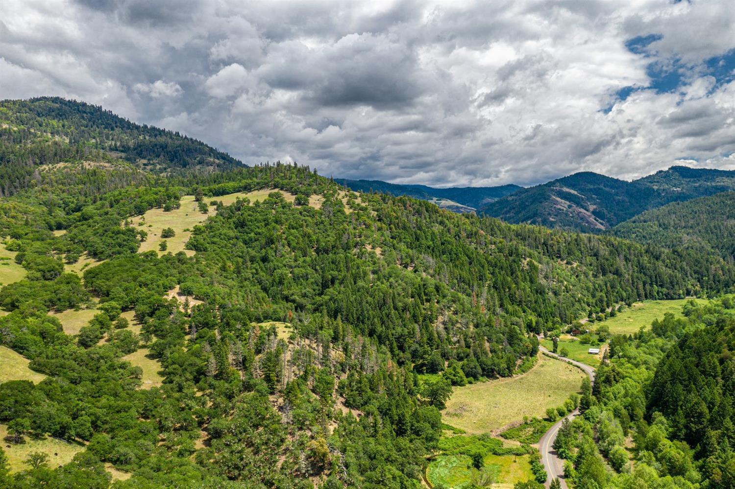 This ranch features 309 (+/-) acres that is comprised of irrigated pasture, dryland pasture, moderately wooded draws, timber and some of the best recreational opportunities for the outdoorsman that the region has to offer. Private, yet just 18 miles to Eagle Point & 27 miles to Medford Airport. Over 2,000 ft of Little Butte Creek frontage w/ 21 irrigated acres. The upper 255 acres is comprised of rolling to moderately steep topography, beautiful treelined grazing pastures, wooded draws, great game habitat and a spring located on the upper bench. The entire property north of the Creek is accessible by ranch roads. Property includes historic cabin, barn, storage container, sheds, well, septic system & perimeter fencing. Several great homesites locations with breathtaking settings. Located in the Rogue Hunting unit & eligible for landowner preference tags. Adjoins 50,000(+) acres of public lands. This property is truly an outdoorsman's dream.