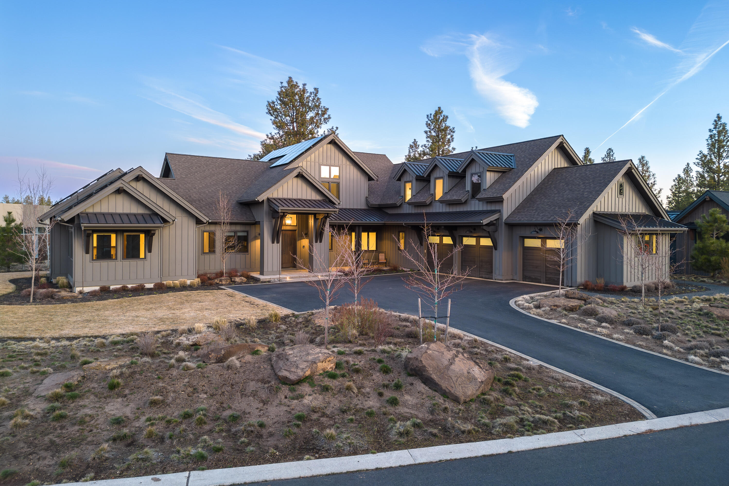 Remarkable custom home on a spacious Cascade-view lot in Tetherow that was thoughtfully curated with no details overlooked. Featuring an open great room floor plan with folding doors for indoor/outdoor living and entertaining. The primary suite, guest suite, office and office nook are on the main floor. Two more bedrooms, loft w/ deck to take in the killer views and bonus room are upstairs. Extensive custom cabinetry in the chef's kitchen w/ luxury appliances that include 2 ovens, 2 dishwashers, extra refrigeration, formal dining with buffet, a built-in breakfast area, and butler's pantry. The primary suite features vaulted ceilings, 2-way fireplace, radiant bathroom flooring, and steam shower. Outside enjoy a large covered patio w/ heaters, kitchen pass-through, built-in BBQ, firepit, hot tub, shower, & water feature. With two laundry rooms, 3-car heated garage & ample storage, you'll think you designed the home yourself. Prime location w/trail access and proximity to schools and NWX