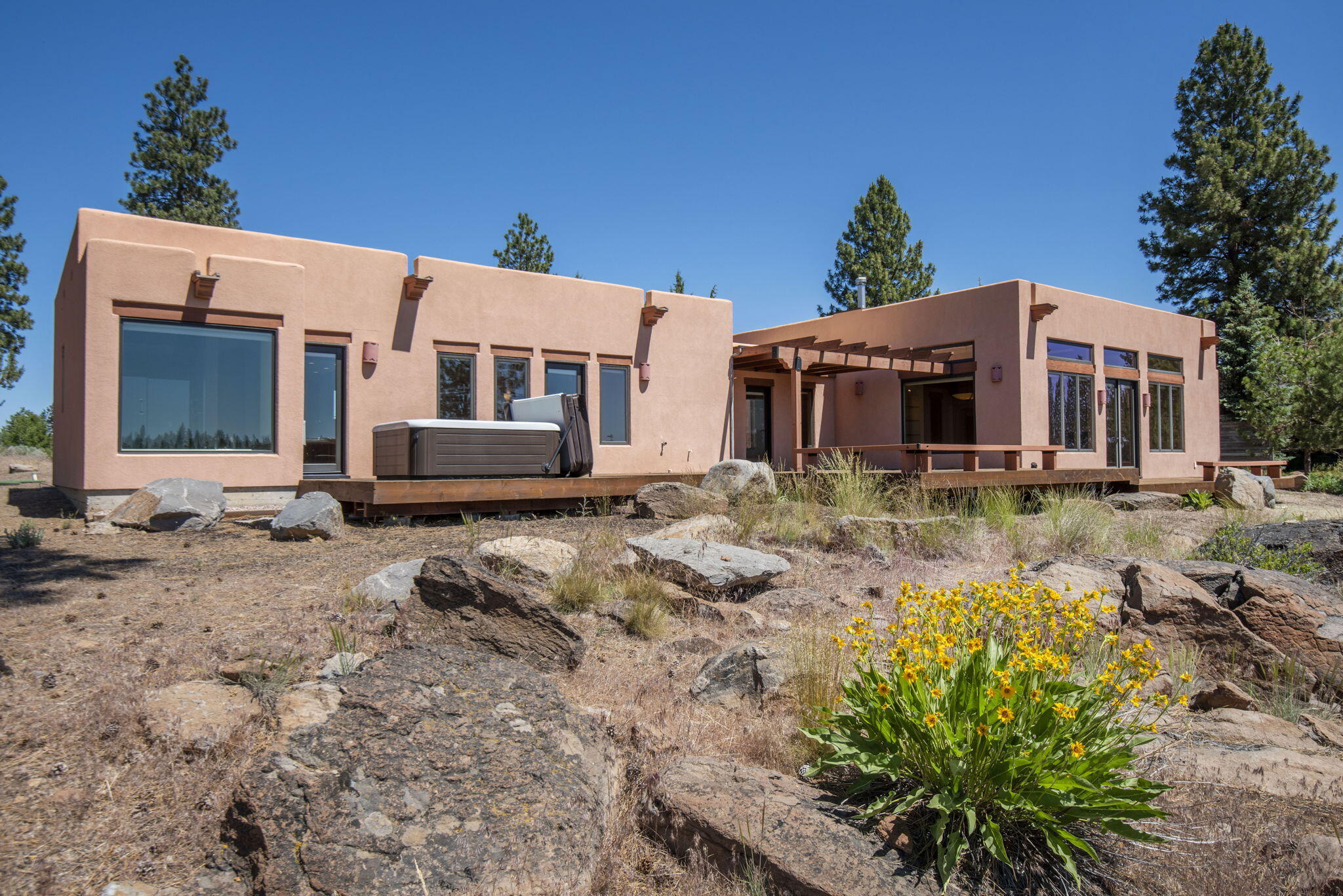 Beautifully architectured stucco home with the coveted views on the Whychus Canyon and Cascade Mountains. Enter through the courtyard to this charming 
residence of one level living on .83 acres. featuring 3 bedrooms, 2 1/2 baths with a large primary suite, walk in closet with ample storage. Soak in the tub with 
views of a lifetime! Experience the warmth of the natural lighting, high ceilings with natural wood beams and elegant light fixtures throughout. The spacious 
great room has character and features a cozy propane fireplace and wood stove. The dining room is ideal for hosting intimate gatherings or elaborate dinner 
parties. This home offers plenty of space for family and guests and features unique charm. Large Ipe Brazilian deck with hot tub on the Whychus Rim with 
Cascade Mountain Views are perfect for outdoor entertaining. The triple car garage provides both convenience and storage options. See.71 acre vacant lot Next Door active on MLS 17127 Mountain View Rd.