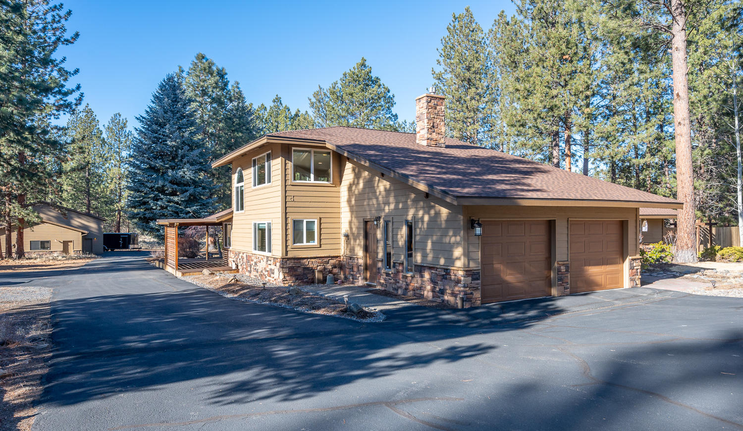 Peaceful & private Woodside Ranch! Backing directly to DesChutes Nat'l Forest & minutes to downtown Bend, this updated 4 bed/3 bath/3 living spaces traditional northwest home on 2.26 acres is a private gem.  The huge heated shop with four bays & office is a perfect place to work from home. The house features gorgeous oversized windows/skylights, vaulted ceiling, English Pub engineered hardwood flooring, three fireplaces, beverage bar, wine cooler/pantry, & is wired for surround sound.  The kitchen has slab granite counters, stainless steel appliances, LED under-mount & recessed lighting. Spacious master suite has two walk-in closets and overlooks the private courtyard & pond. Open loft (464 sf) upstairs with built-in side by side work stations. Landscaped, wrap around deck, hot tub, paved driveway, RV storage/parking, AND MORE.  Home warranty included. Listing agent is owner and licensed broker in Oregon and is a principal in the transaction. Offer deadline is Tuesday, Feb. 2, 4:00 pm.
