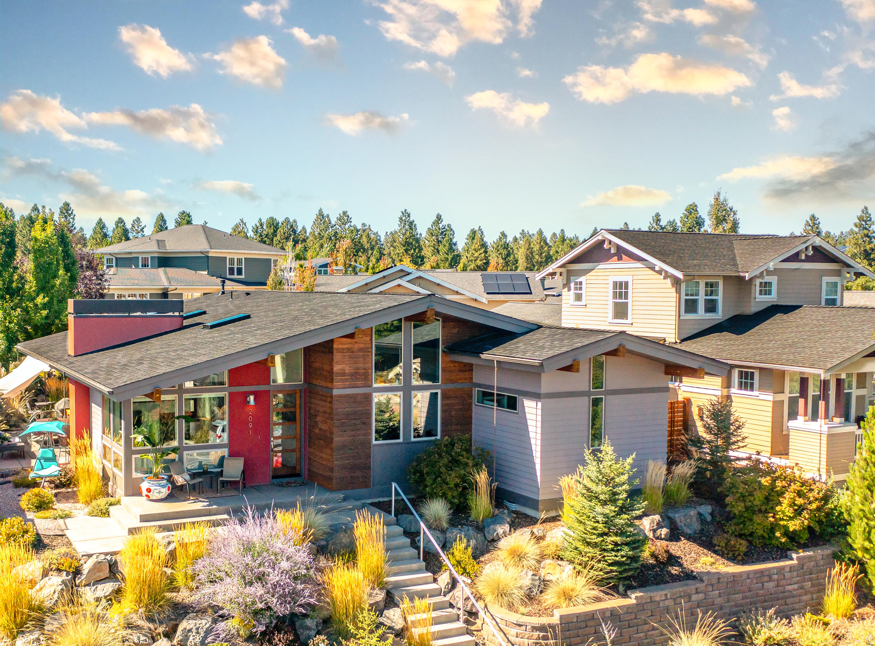 A must-see! Celebrated NW architect of the Mount Bachelor Pine Marten Lodge, Vernon Sexton, designed this custom, modern, mid-century with soaring ceilings and beams, luxury, privacy-tinted windows that capture the sky and treetops over the neighborhood. Every aspect of this show-stopping, single-level home is distinctly high-end & move-in ready! Perfectly located in the heart of WestSide Bend living. Close to the Phil's Trail system, NWX farmers market, downtown, etc! Walnut floors, copper three-sided gas fireplace, white lacquered and elegant glass tiles throughout. Brand new BlueStar range. Jennair fridge, oven warmer, and best-quality appliances, lighting, fixtures. Farmhouse Nativestone kitchen sink and counters. Epoxied two-car garage, large shed, and three extra parking spots outside garage. Open and ideal for a couple to host large parties but also enjoy the charming trails 1000 feet from the front door. Outdoor areas seat up to 20 people. So much storage space!