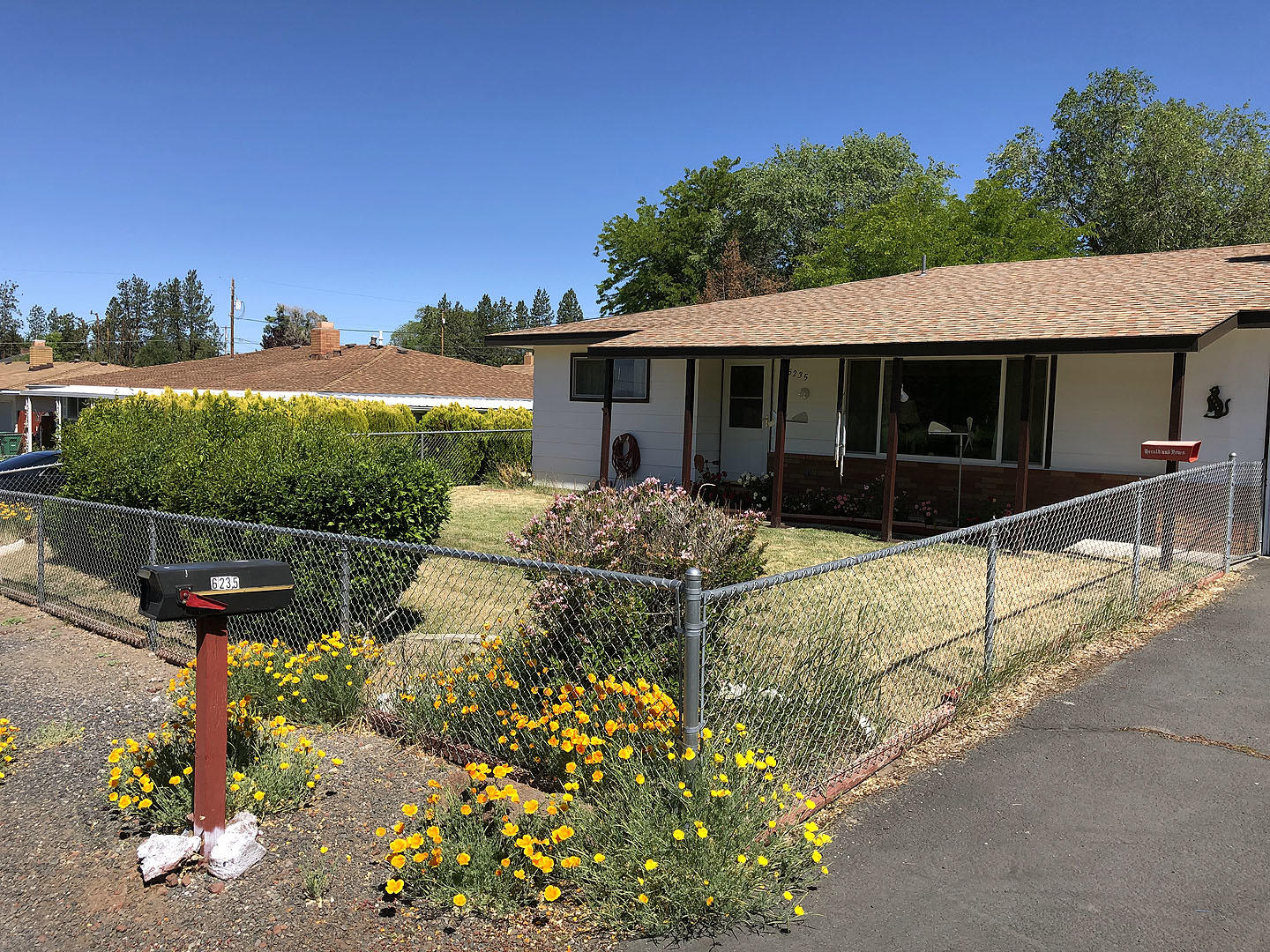 Come see this well-maintained home with privacy fenced backyard. Listen to the birds sing in the 2 apple trees on the back deck. Front yard is fenced as well. 3 bedroom/ 2 full bath home with utility room and 1 car garage. There is a carport next to the garage. As is seller is unable to make repairs.