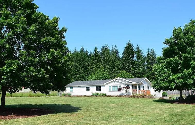 Open House from 11 to 2 this Saturday!  Open House Special... Seller offering $24,000 toward buyer's interest rate buydown. Could be up to a 1% lower rate!!  Courtesy to Brokers! Quick close possible with seller relocating for business—this beautifully maintained 3-bed, 2-bath Peaceful Acre Retreat boasts 1,760 sq. ft. of open living with vaulted ceilings, skylights, solar tubes, and a smart split floor plan on a level, fully fenced acre with no easements. Privately tucked away on a flag lot yet just half a mile from local favorites like Kissin' Kate's, Red Barn Country Store, Creek Coffee, Taqueria Jalisco, and Beavercreek Grocery, it perfectly blends rural charm with everyday convenience. Recent upgrades include new flooring, low-E windows, 2021 HVAC, and a modern kitchen with all-new stainless steel appliances, premium induction cooktop, RO water system, and refrigerator—plus a versatile shop with 11.5' garage door for all your projects!!