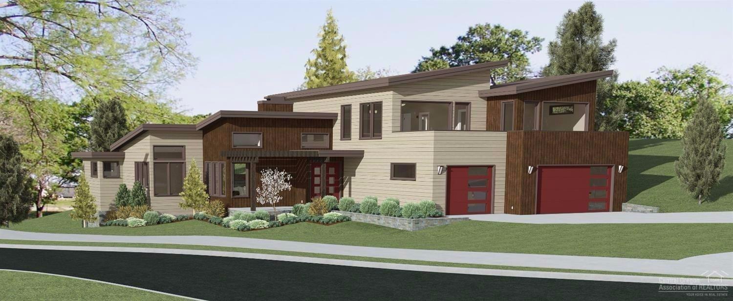 Welcome home to this custom build by Visionary Homes, located on an exceptional lot in Tetherow's Cascade Vista neighborhood. A modern exterior w/ clean lines & ample windows situated on a corner lot w/ Cascade Mountain, golf & park views. Inspired design features a main floor master, a great room concept opening to a custom, tiered rear yard that backs to common space & Bend Parks land, and upstairs: three bedrooms & 3 baths w/ an outdoor living area boasting stunning views & gas for a fire pit & BBQ.