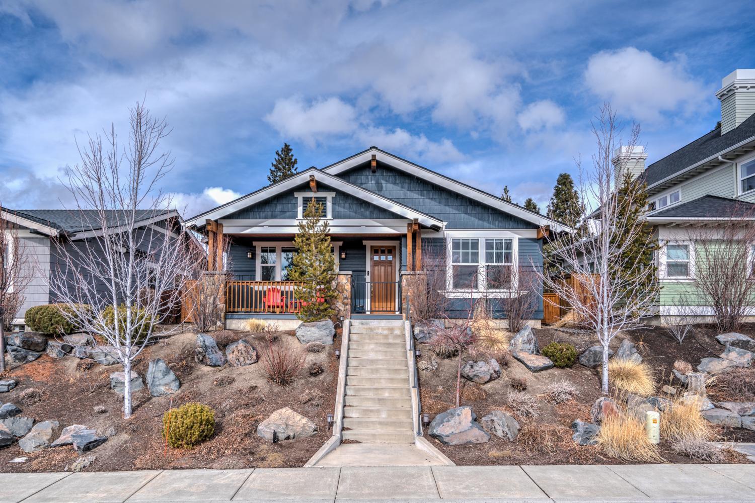 This stunning single-level NW Crossing home is a rare gem that boasts both privacy and sunny mountain views while being located a quick walk or roll from restaurants, markets, parks, trails, gyms and schools. Enjoy the sweeping southern exposure and sunsets over Mt Bachelor from your front porch with a treat from one of the many nearby eateries. The zen backyard features rich landscaping, a fountain, fruit trees, a heated covered patio, and more mountain views. Inside you'll enjoy timeless craftsman styling with a great room, acacia hardwood floors, custom built-ins, coffered ceilings and an office nook. The oversized laundry room & garage offer plenty of storage space for all your toys. This home has been meticulously maintained and updated with nearly $100k in improvements in the last year including new roof, real stone fireplace, and new countertops throughout. This is Bend & NWX living at its finest.