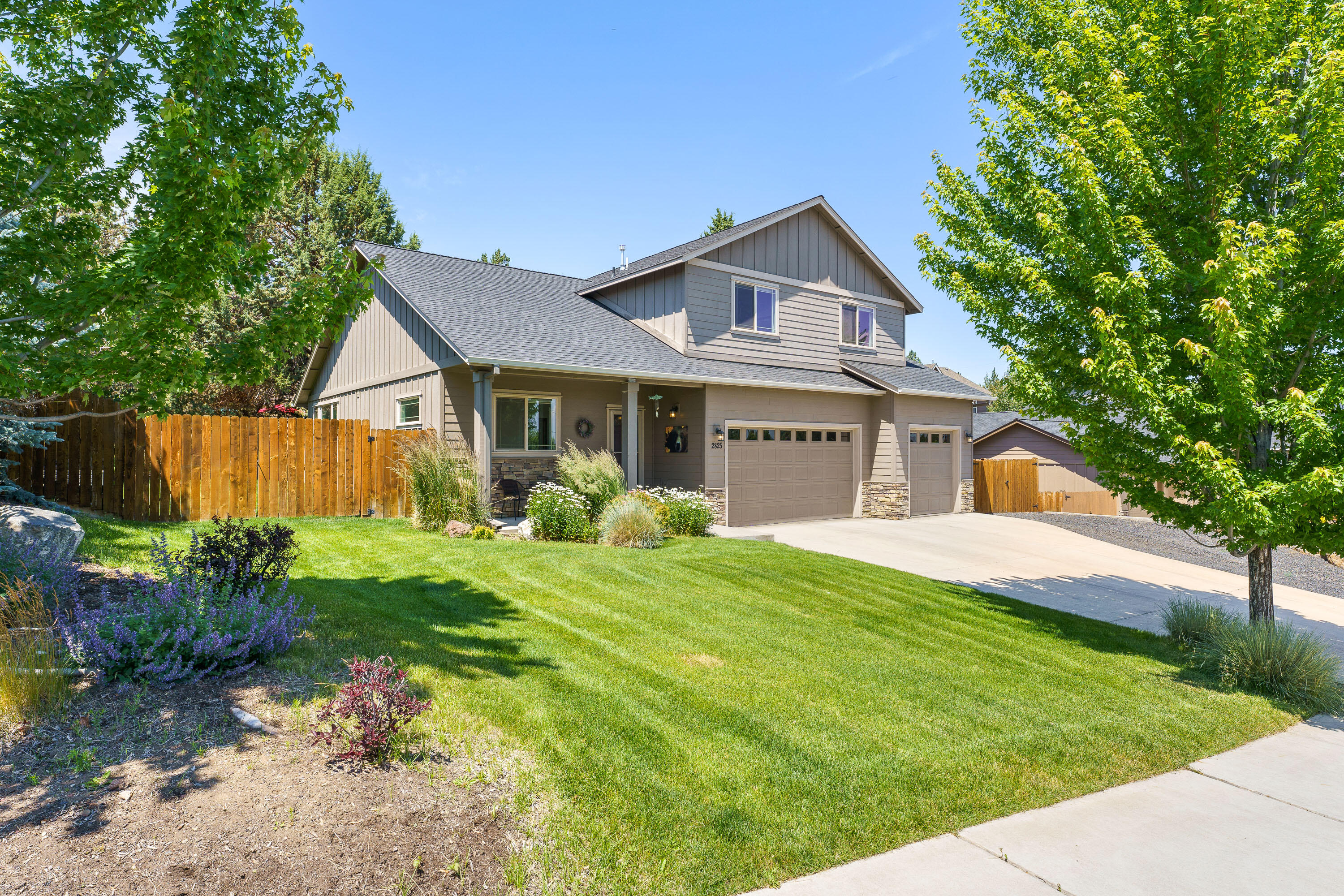 Well cared for and full of space, this home offers mountain views and is tucked into a peaceful SW Redmond neighborhood with quick access to Hwy 97, the airport, and nearby parks. A dedicated office is just off the entry, leading into an inviting great room with a cozy gas fireplace. The kitchen is both functional and stylish with quartz counters, a breakfast bar, stainless steel appliances, and a corner pantry, flowing into a light-filled dining area with sliding doors to the backyard. The expansive main level primary suite offers privacy and comfort with a walk-in closet, and an ensuite bath with double vanity. Upstairs, you'll find three spacious bedrooms, a full bath with dual sinks, and a generous bonus room - perfect for additional living, play, or workspace. The fully fenced backyard is a private retreat with mature landscaping, lush grass, sprinklers & a paver patio. Additional features include a 3 car garage, dual gated RV parking, and natural gas forced air with A/C.