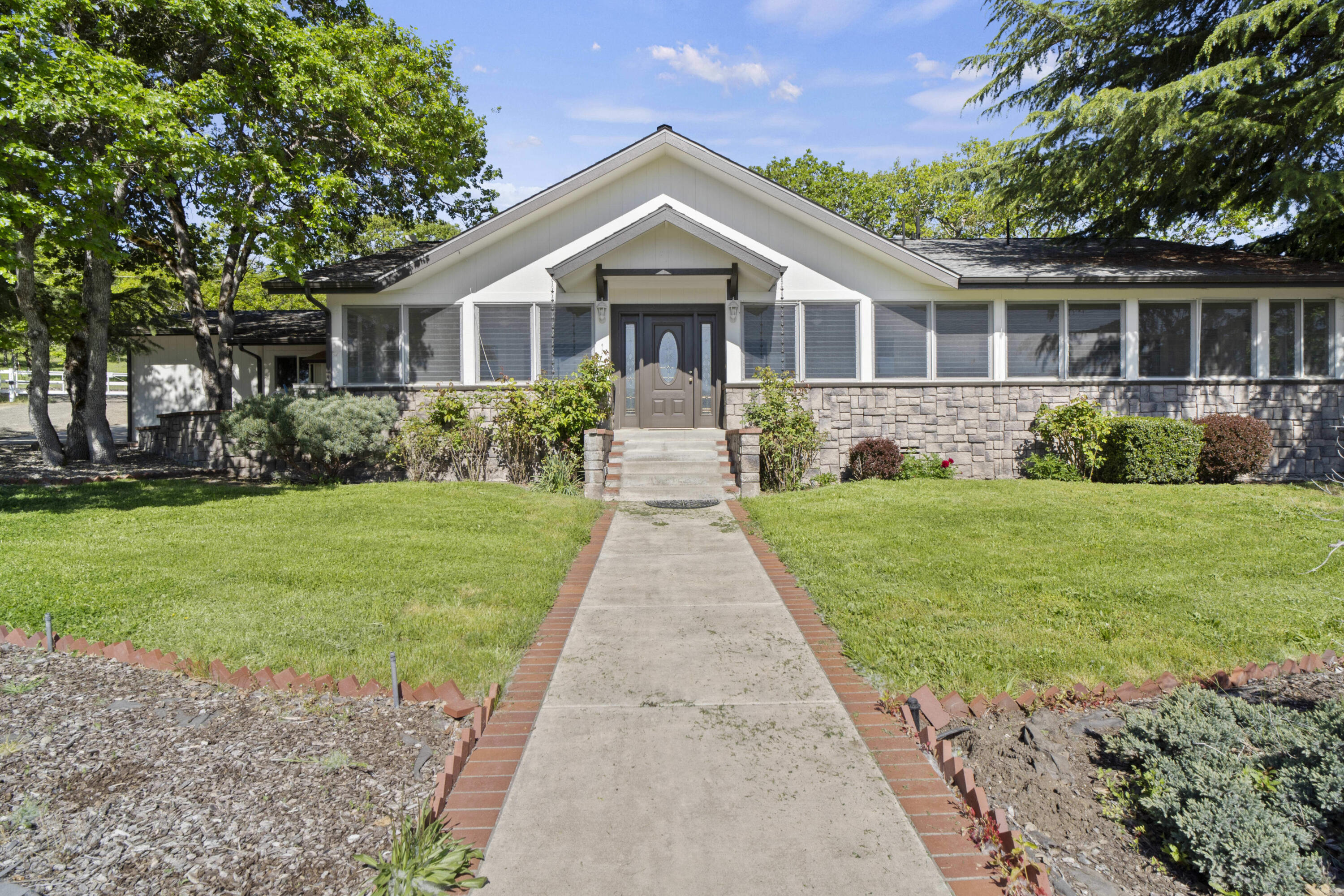 Thoughtfully designed and built with love and passion, this incredible property has everything you could ask for: 14.9 level EFU acres (pesticide free) with 10.9 acres of documented water rights from 2 high producing wells and 4 permitted storage ponds; a 29' x 92' insulated barn complete with heated break room with kitchen, covered tacking area, lockers, box stalls, hay loft, office, drive through RV/shop area, wine/root cellar and more. The 2nd floor has a beautifully maintained 2 bed, 1 bath apartment. Continuing outside, enjoy the fenced garden and extensive storage space. The main home is a comfortable 3 bed, 2 bath single level with lots of updates and huge sunroom overlooking the ranch. Don't let this opportunity slip away!