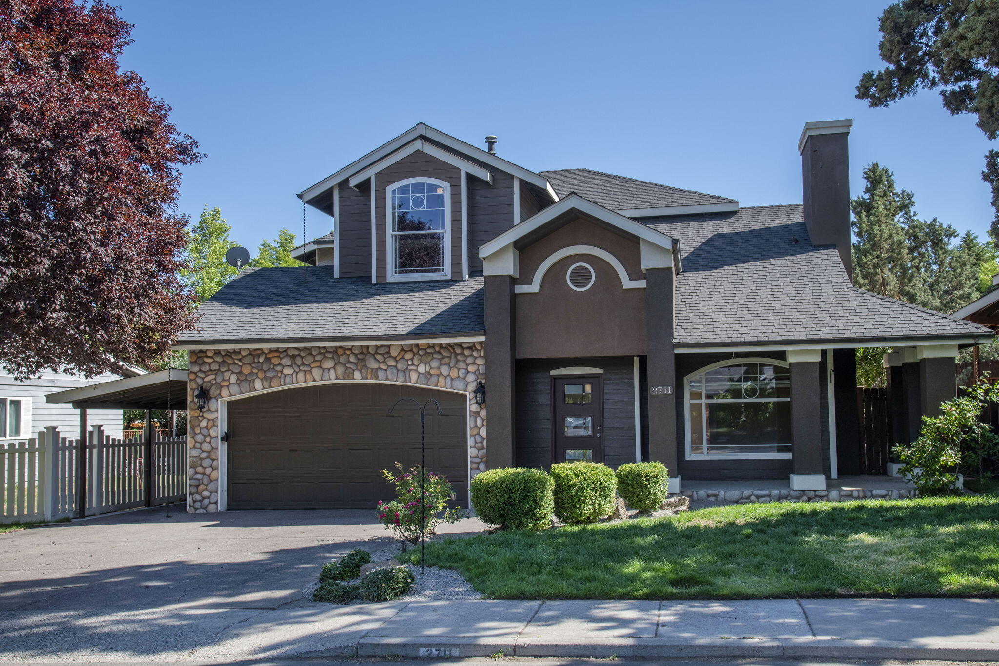 This is not your typical cookie cutter home on a postage stamp lot! This 2,658 sq. ft. custom home features elegant and sophisticated decorative details throughout. A separate 440 SF heated ''home office'' with bathroom may have the possibility of being converted into an ADU. Great room floor plan, arched doorways, 2 fireplaces, custom iron railings & engineered hardwood flooring throughout. Granite kitchen countertops, tile backsplash, SS appliances, pantry, breakfast bar. Huge primary bedroom, double entry doors, full moon window, travertine tile flooring, counters, shower, dual designer vanity, large soaking tub. As well as an adjoining office with an elevated walkway & small balcony. Awesome bedrooms w/built-in bunk beds, sliding glass doors, balcony overlooking the living room. A fabulous .24-acre corner lot, multilevel custom covered concrete patio, firepit, fully fenced & water feature. Lots of character, charisma & uniqueness within blocks of shopping, restaurants & hospital.