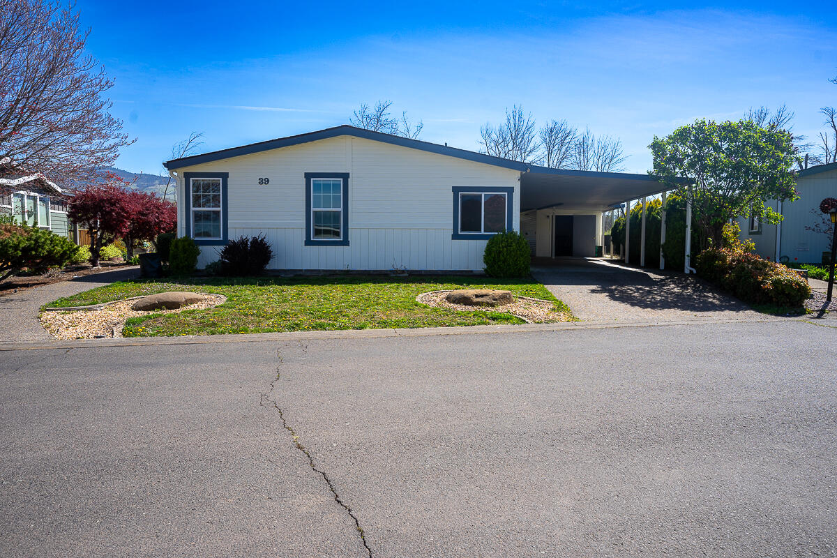 Nestled in a prime location within Mountain View Estates 55+ Manufactured home park, this home is a must see. Built in 1989, this home survived the Almeda fire with minimal fire damage to the property. The 1809 sq. ft. of living space includes 2 bedrooms, 2 bathrooms, an office/den, a living room, a family room, a dining room, and a lot of storage. Windows line the East and South sides of the home giving an abundance of natural light as well as views of Bear Creek and all of the wildlife present there. The kitchen includes a low bar with 3 chairs for casual dining and a brand new refrigerator purchased in December of 2022. The large driveway can easily fit 4+ cars and includes a spacious shed/workshop/office for all of your tinkering or storage needs. The home has been recently painted inside and out. Park allows a single pet up to 25lbs. The listing agent is related to the seller.