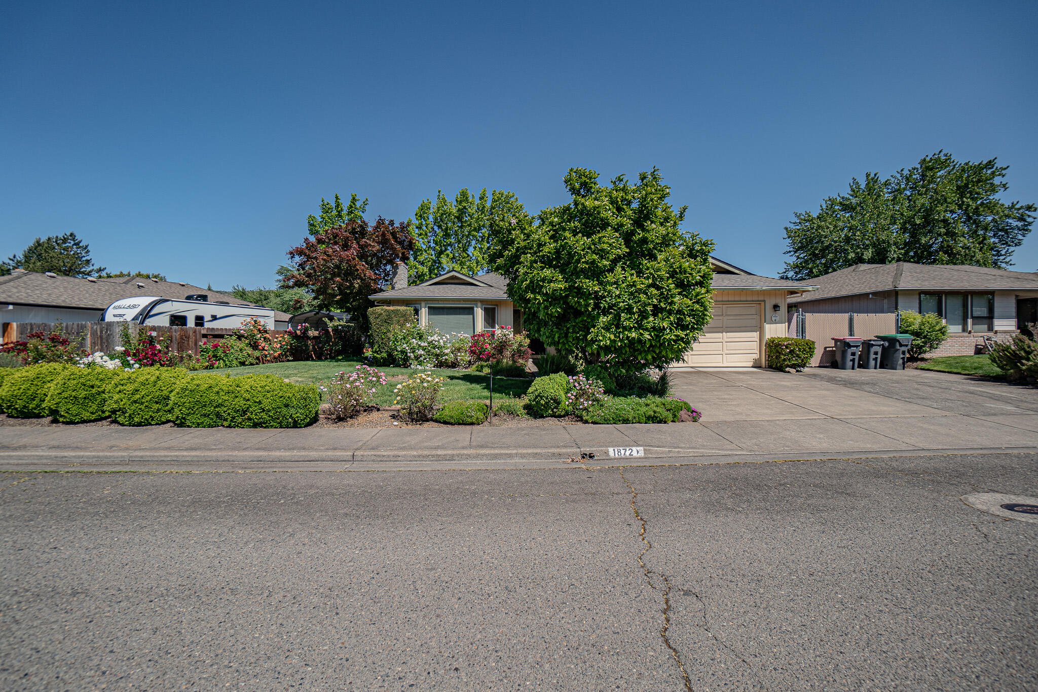 This East Medford home has over 1797 sq.ft. of living space with 3 large bedrooms and 2 full bathrooms. As  you enter this home you will notice the large living room that offers a lot of natural light as well as an eating area located off the kitchen. The kitchen has plenty of cabinet and counter space. The primary bedroom, located at the back of the home, has double vanity and walk-in closet. The other two bedrooms are large too. Inside washer/dryer. New toilets as well as a brand new efficient water heater. The backyard has mature landscaping and there is even gated RV parking.