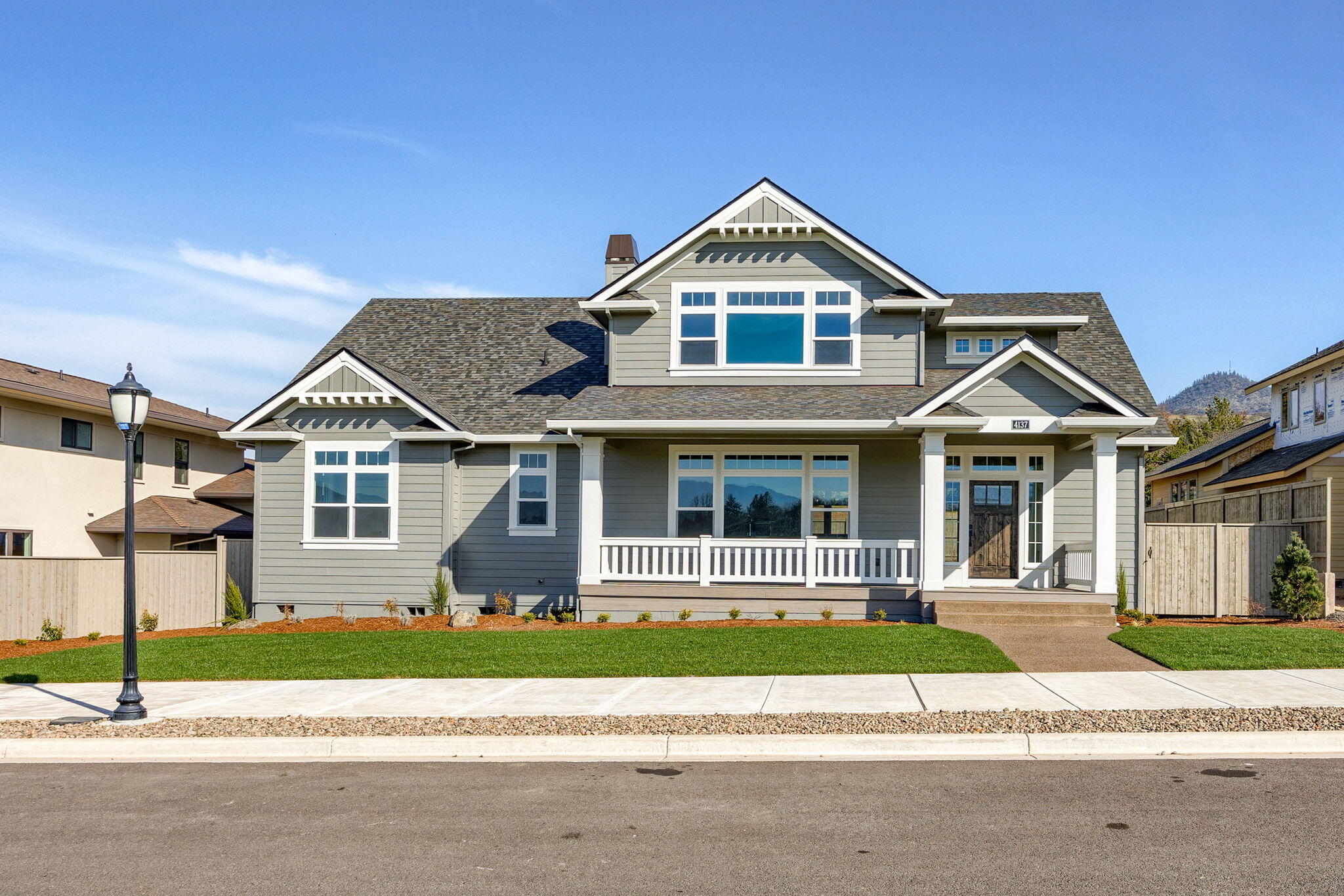 Brand new, one-of-a-kind, craftsman style home in Summerfield!  Beautiful views from most of the rooms in this custom designed home.  Large, white painted, island kitchen with Kitchen-Aid appliances, double ovens, and a large walk-in pantry.  The primary suite is on the main level and has a luxurious bathroom with double vanity, free standing soaking tub, walk-in shower, and spacious master closet.  There are four bedrooms and 3 full baths.  One of the bedrooms is ideal for an office and is on the main level.  There are two bedrooms and a bonus room upstairs.  Gorgeous hardwood floors in all the main living areas.  Quartz counters throughout.  Tile showers and floors in the bathrooms and laundry. There is a wonderful, covered front porch to take in the views.  The fully landscaped and fenced backyard also has a nice covered patio.  The three car garage is in the rear of the house.  Earth Advantage Certified.  The listing agent is related to the seller.