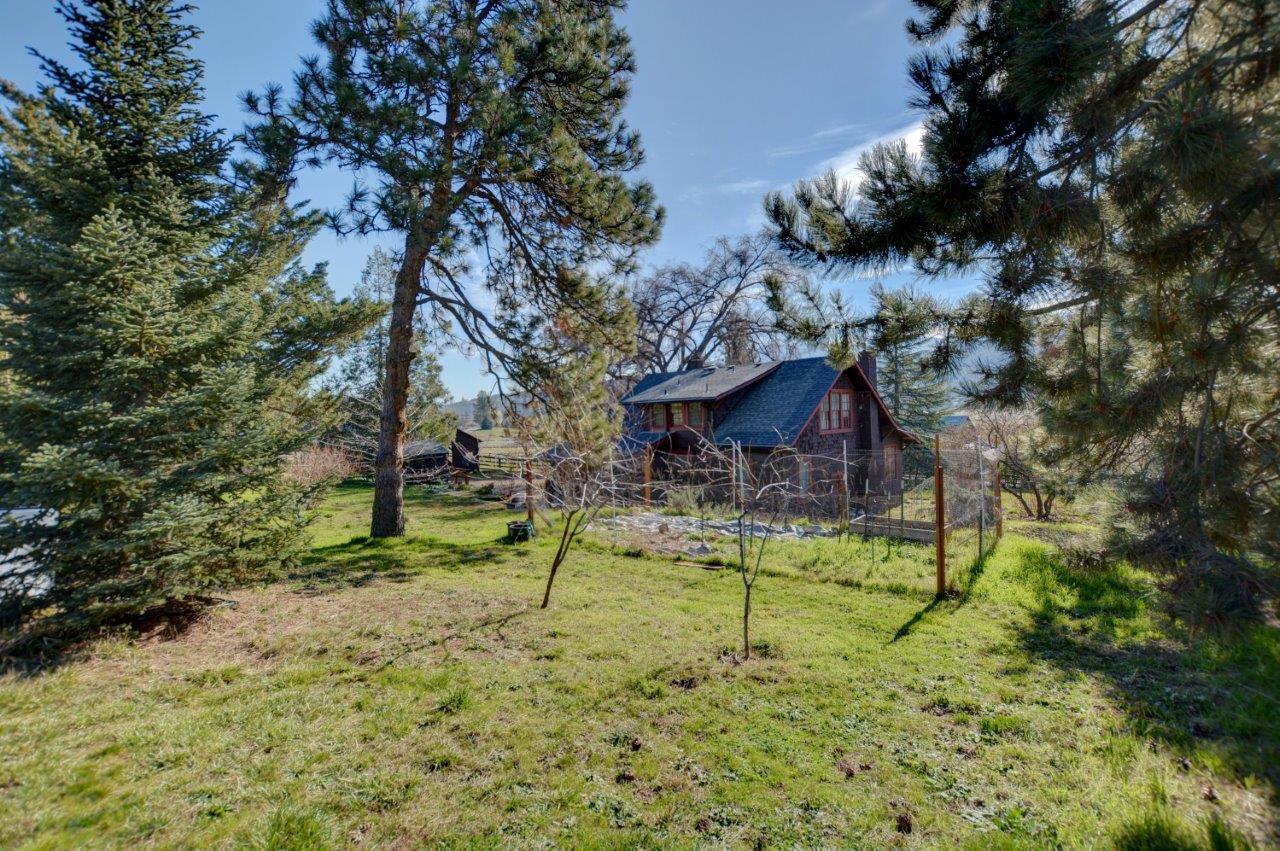Beautiful farm property on 4.99 irrigated acres. The renovated 2 story farm house is located 10 minutes from town on a sleepy lane . The home is 4 bed/ 2.5 bath with a formal dinning room. The gourmet farm style kitchen is appointed with a 6 burner Kitchen Aide cooktop , large double ovens, 2 dishwashers, an oversized refrigerator, tons of cabinet space and travertine floors. The kitchen flows into the large formal dinning room. The cozy living room with large windows and a fireplace insert overlooks the property and the nearby mountains. The generous mud room is attached to the kitchen and has a separate laundry room. Upstairs find the additional 3 bedrooms and large bathroom. The property is cross fenced, RV hookup's, 125' pole barn and tack room. See amenity 
list in documents .