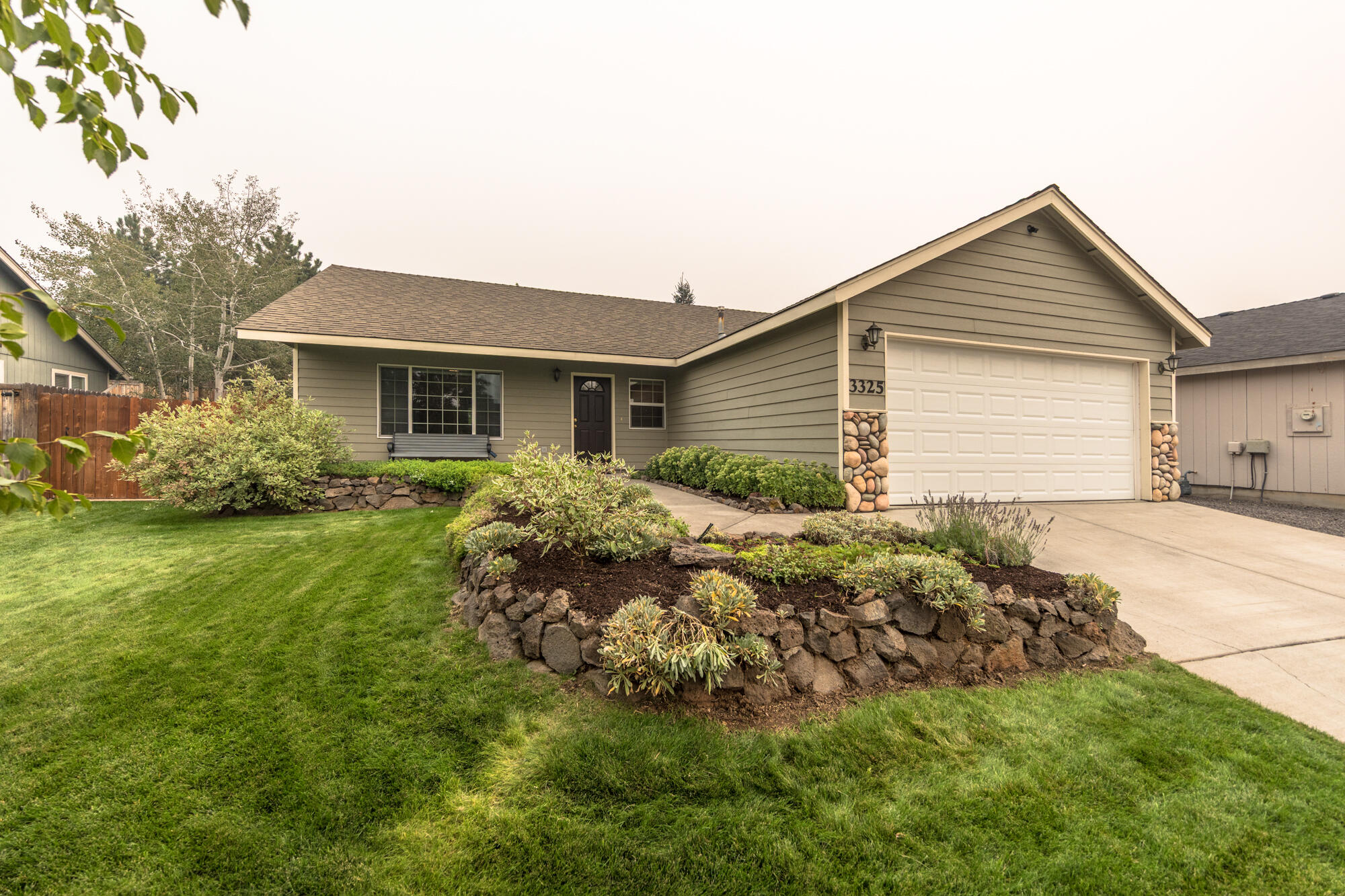 This well-kept 3-bedroom, 2-bathroom single-level home is ideally located in NE Bend on a quiet street, just minutes from shopping, restaurants, coffee shops, and St. Charles Hospital. Enjoy a functional open floor plan perfect for hosting dinner parties or cozy nights in. The primary suite offers a walk-in closet and a comfortable retreat after a long day. Outside, the beautifully landscaped yard provides a peaceful setting, and the attached 2-car garage adds convenience. Only 1 mile to On-Tap and close to medical facilities, this home is a perfect choice for first-time buyers, downsizers, or as an investment property.