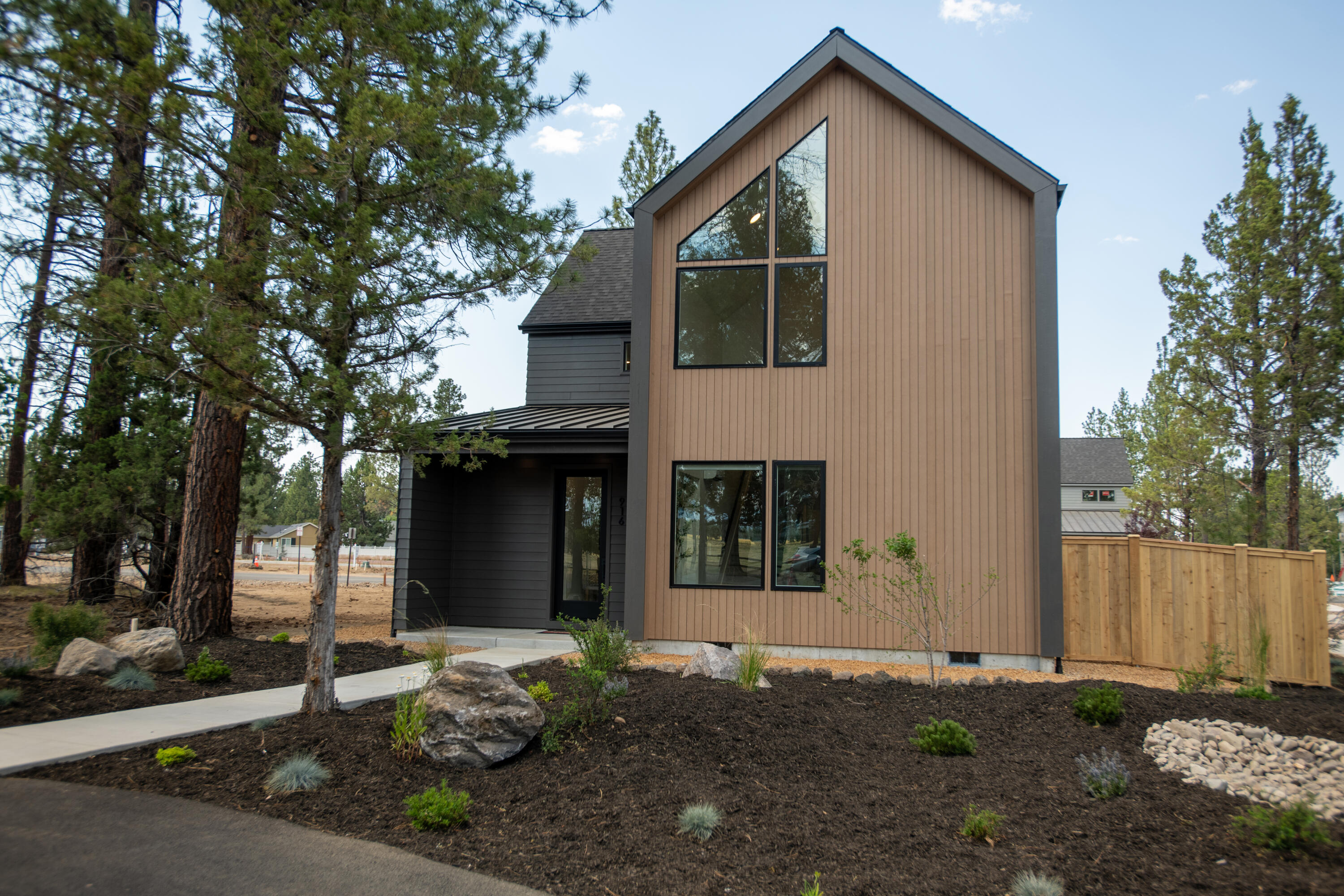 Sunset Meadows - the much anticipated new development in Sisters,Oregon - has begun selling Phase 2! Built by award winning builder Woodhill Homes.The Contemporary Modern Mountain Chalet design of the homes give the neighborhood the look & feel of a mountain resort. The Cascade Mountain Range, including the Three Sisters & their magnificent views are along McKenzie Highway - and directly in front of this property. This home is a Single Family Home is just under 2,000 sq.ft. with 3 bedrooms and 2 1/2 bathrooms.The main floor is an all open floorplan w/large windows & vaulted ceilings to allow the Central Oregon sunlight to shine through. Primary Bedroom w/ensuite bathroom is on the main floor. Stainless Steel Kitchenaid appliances & solid surfaces in the kitchen & bathrooms - 1/2 bathroom and laundry room downstairs and 2 bedrooms, a full bath and a large loft upstairs. Attached 2 car garage. Your chance to own a brand new, beautiful home in Sisters.
