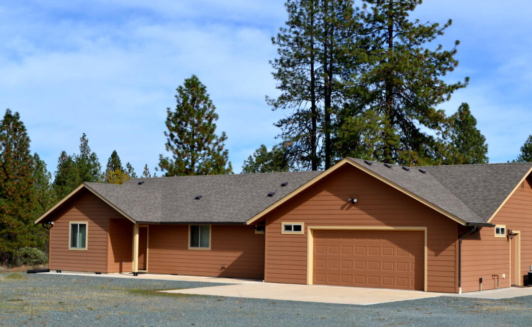 This private mountain retreat truly has it all! The brand-new main home features a great split floor plan and a custom kitchen with high-end appliances. Designed for total energy efficiency and self-sufficiency, it was built for the owners but never lived in. The property also includes a charming guest house in the original home—perfect for extended family or guests. Outside, you'll find a spacious workshop, a serene pond, open meadows, and beautiful wooded areas—all fully fenced for privacy and peace of mind. Come see it for yourself and experience the tranquility this property offers!