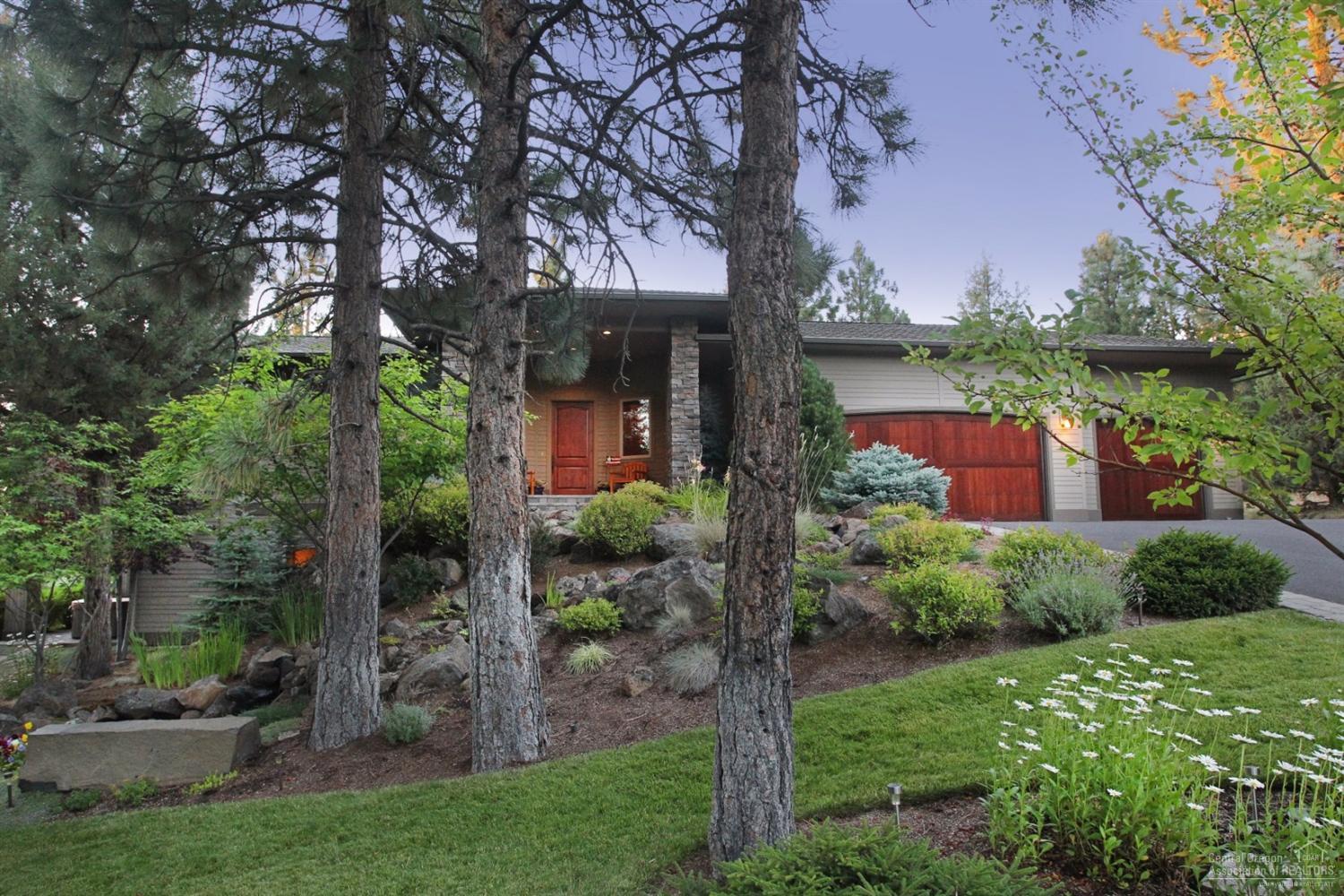 Quality craftsmanship and attention to detail can be found throughout this custom Awbrey Butte home. Located on a large corner lot with Cascade Mountain views and immaculate landscaping, this home gives a sense of privacy that's highly sought after. This home is complete with a gourmet kitchen, wine room, open floor plan with 10' ceilings and cozy decks to enjoy the colorful Central Oregon sunsets. The master bedroom is located on the main level and the downstairs has 2 additional suites and a family room.