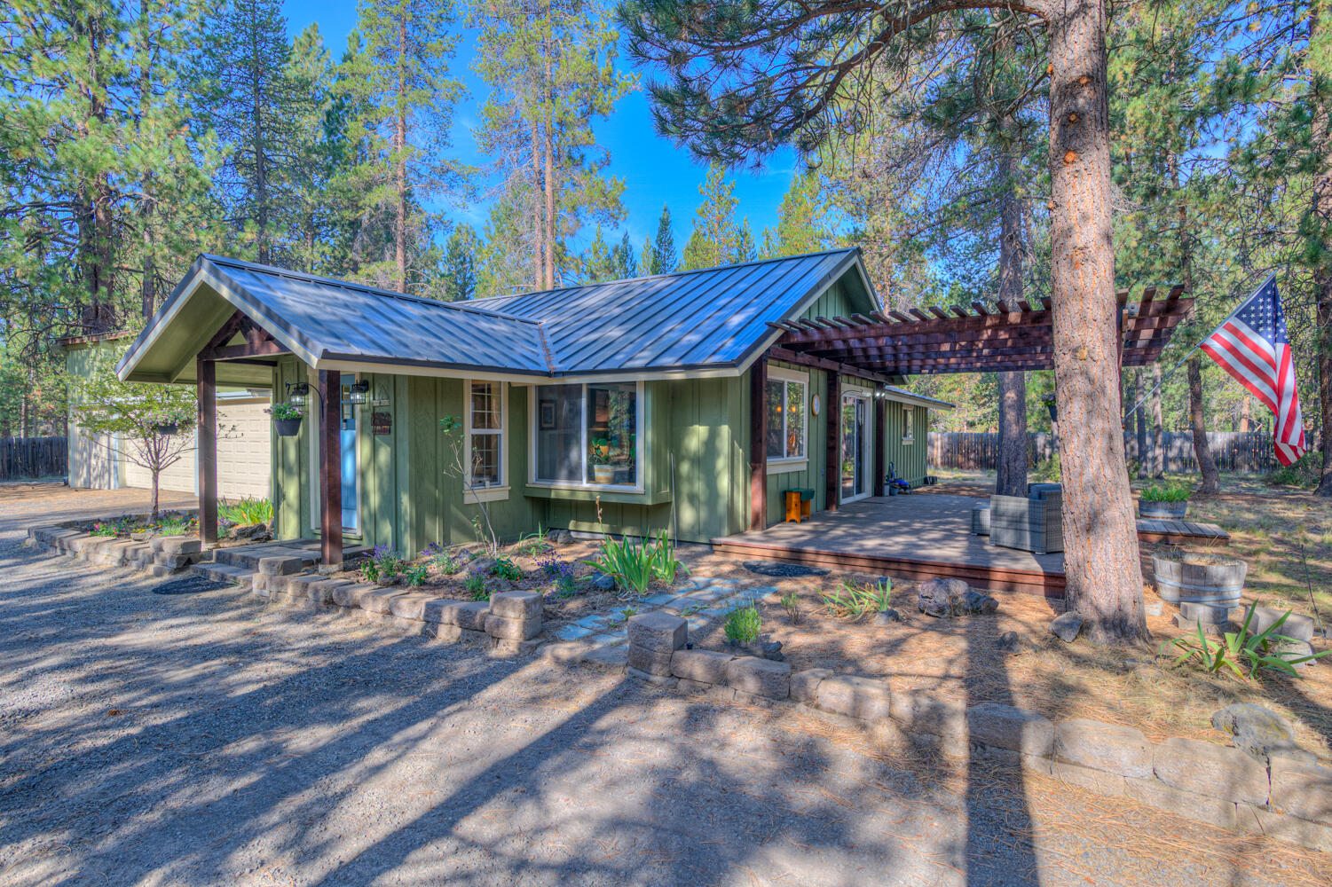 Looking for a stick built home in La Pine on a 1 acre lot fenced with mature ponderosa pine trees. This home is located in Newberry Estates just minutes to Mt Bachelor, Paulina lake, East lake and all the High Cascade Lakes. This 2 bedroom 2 bathroom home has over 1180 sq. ft of living space, Open Great room with wood vaulted ceilings, wood style floors, barnwood doors, solid surface kitchen countertops, stainless steel appliances, newer windows throughout. Custom bathrooms with tile shower and tile floors. Large deck off the dining area and Great room. This property has a 3 car shop with 3 garage doors and one with an opener. There is a work bench area. The town of La Pine is just minutes away for all of your needs. Come see what this home has to offer.
