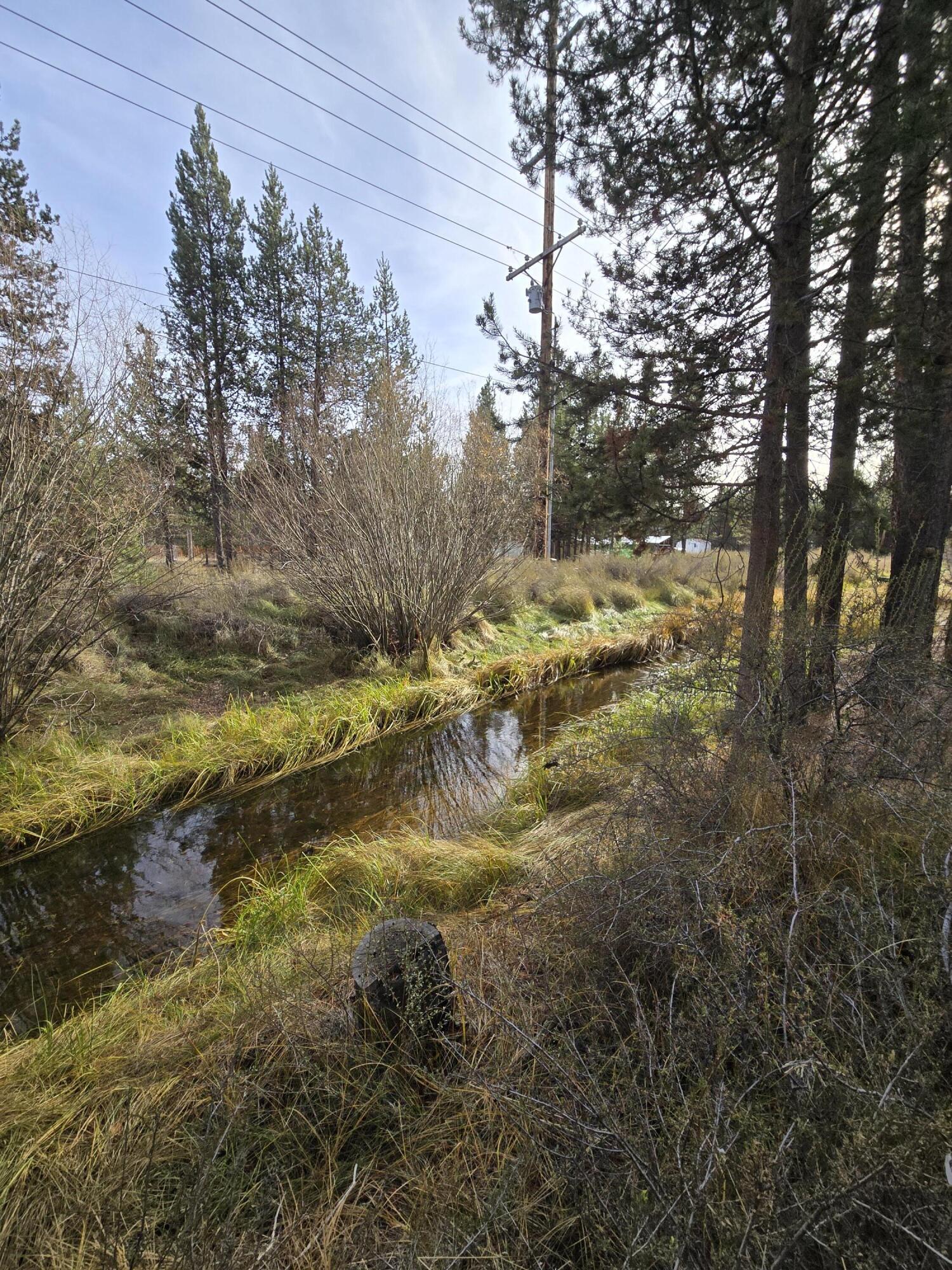 If you're excited build your home in Central Oregon, this property is ready for you! This 1.15  acre lot just 10 minutes south of La Pine is already equipped with electricity, RV hookups, septic and well.  With a canal that runs on the edge of the property and tall Ponderosa trees that are native to the area, BLM land and hiking/biking/ATV trails, lakes, mountains and the gorgeous Deschutes River minutes away-this property is in the ideal location to enjoy all that Central Oregon has to offer year-round. Make La Pine your home (or your home away from home) on this beautiful piece of land that is ready and waiting for you.