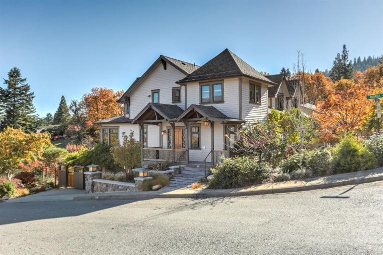 This custom home exudes quality from top to bottom. Gourmet kitchen w/ granite, Cherry cabinets, high-end appliances & extensive built-ins. Sun filled breakfast nook w/ built-in seating & views of Grizzly. Two-story great room boasts clerestory windows, skylights & an impressive lodge style fireplace. The versatile floorplan features a main level bedroom & bath + 3 addtn'l bedrooms, guest bath & Master Suite on the 2nd level. Basement level has addtn'l 1500+ SF & offers a great work from home atmosphere + overflow living space. There's an office, home gym, full bath & wood workshop. The thought & materials that went into this home include radiant floor heat, Asian slate, French & Italian tiles + numerous other stones. Top quality wood windows & durable wood flooring including Cherry & Maple. Bordering an expansive open space, this home offers privacy & views & is located on a choice corner lot just blocks from downtown. Garden, water feature, ornamental fencing, & multi-level decks.