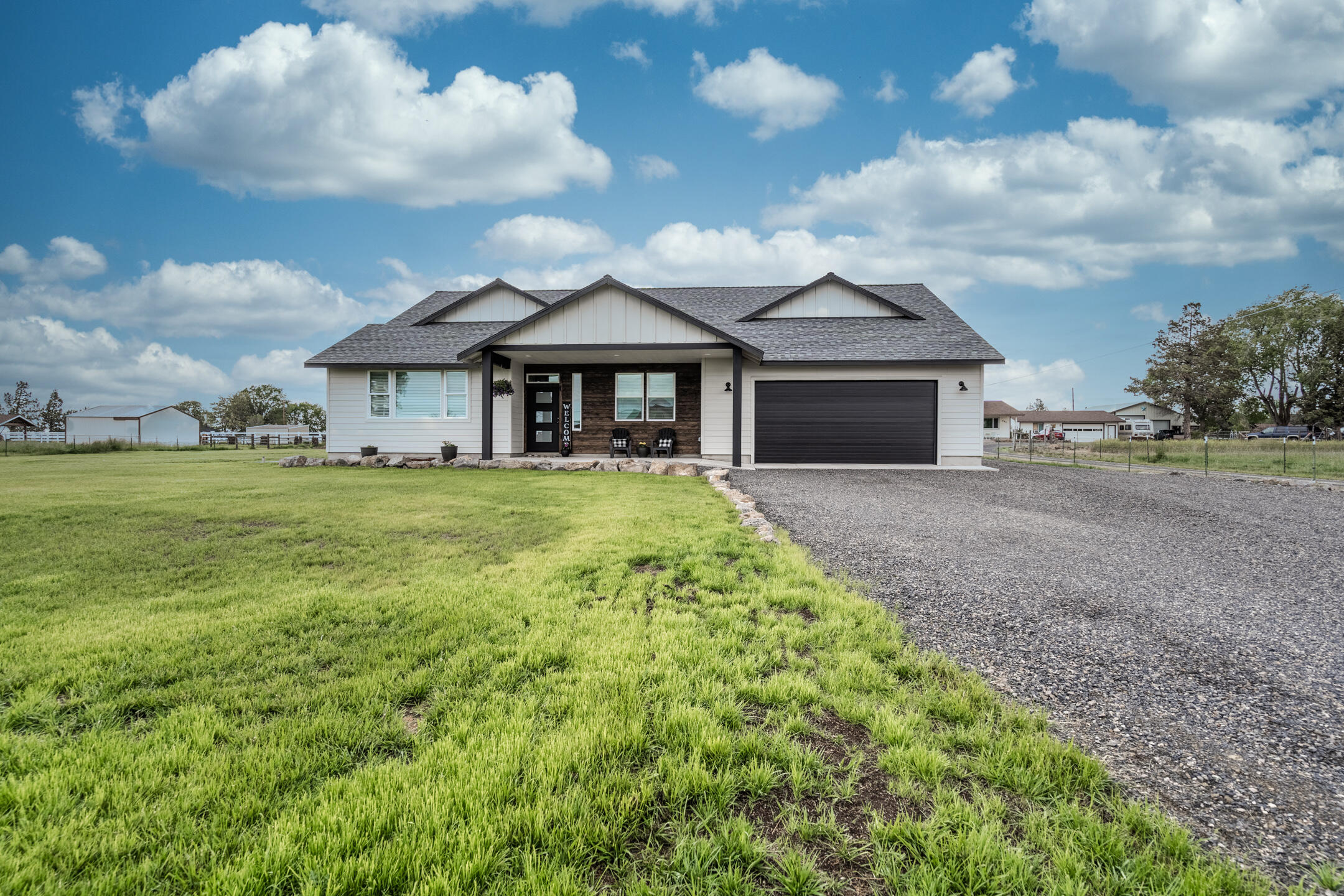 Brand new home on a private and irrigated 1-acre lot, located in a peaceful neighborhood with mountain views! Thoughtful and bright floor plan with the master suite and a junior suite on the main level, a large bonus room, and an office. Handsome and durable flooring, tons of storage, 9' ceilings, and recessed lighting throughout. The primary bedroom features a huge walk-in closet and a beautiful bathroom with a generous tile shower. Maximize comfort year round with the high-efficiency heating and cooling system alongside a pellet stove to take the chill out of those cold nights.  Detached ~42x36 shop with 12-foot doors and towering 18-foot ceilings. Oversized garage, covered porches, and plenty of RV parking.  This property has been set up with the potential to subdivide 1-2 more lots. This quality-built home will not disappoint.