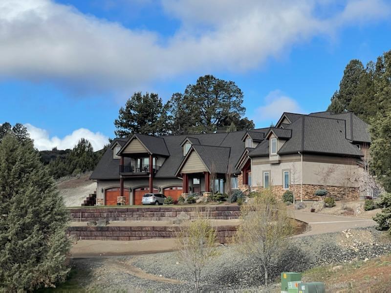 This is an immaculate, exquisite home! 5 bedrooms all with nice walk-in closets and built in shelving and drawers, 4 full baths and 2 half baths, AMAZING views, a fantastic covered patio with a built in fire pit, a theater room, PLUS a bonus room, heated floors in the kitchen and primary bathroom (along with a steamer shower) Quarts countertops, Alder cabinets, all solid Alder wood doors, all on a little over 3acres. Approx 5500 square feet and a 6 car heated garage with a dog kennel for your furry friends, a little piece of Heaven right here in Klamath Falls!