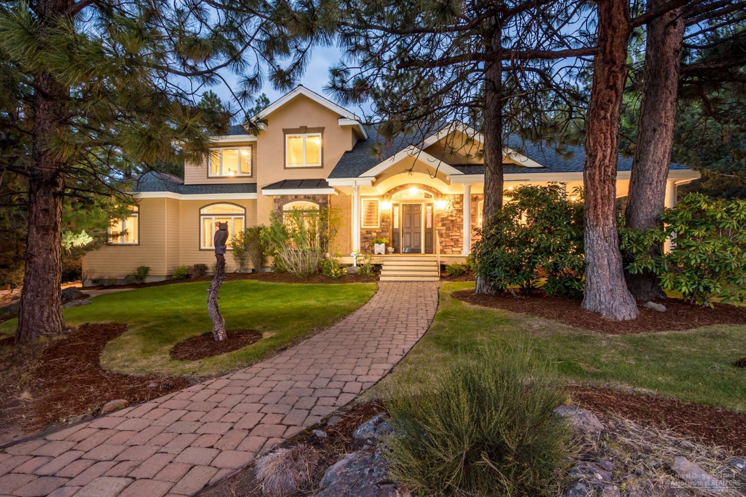 Awbrey Butte Beauty w/ Cascade Views! Nearly level lot nestled in the Pines.Wood Vaulted Ceilings & Pecan Hardwood Floors enhance the Warmth of this Hm.Enjoy your Gourmet Kit, remodeled by Neil Kelly w/ Top-of-Line Appliances.Main level living w/ Master Suite & Den/Library which can serve as a 4th BD.Bonus Rm, 2 Guest BD are upstairs which allow for complete Privacy.Enjoy Outdoor Entertaining w/ Partial Wrap Around Deck, Water Feature & Extensive Use of Pavers.3 Car Gar w/ 1 RV size door, perfect for toys!