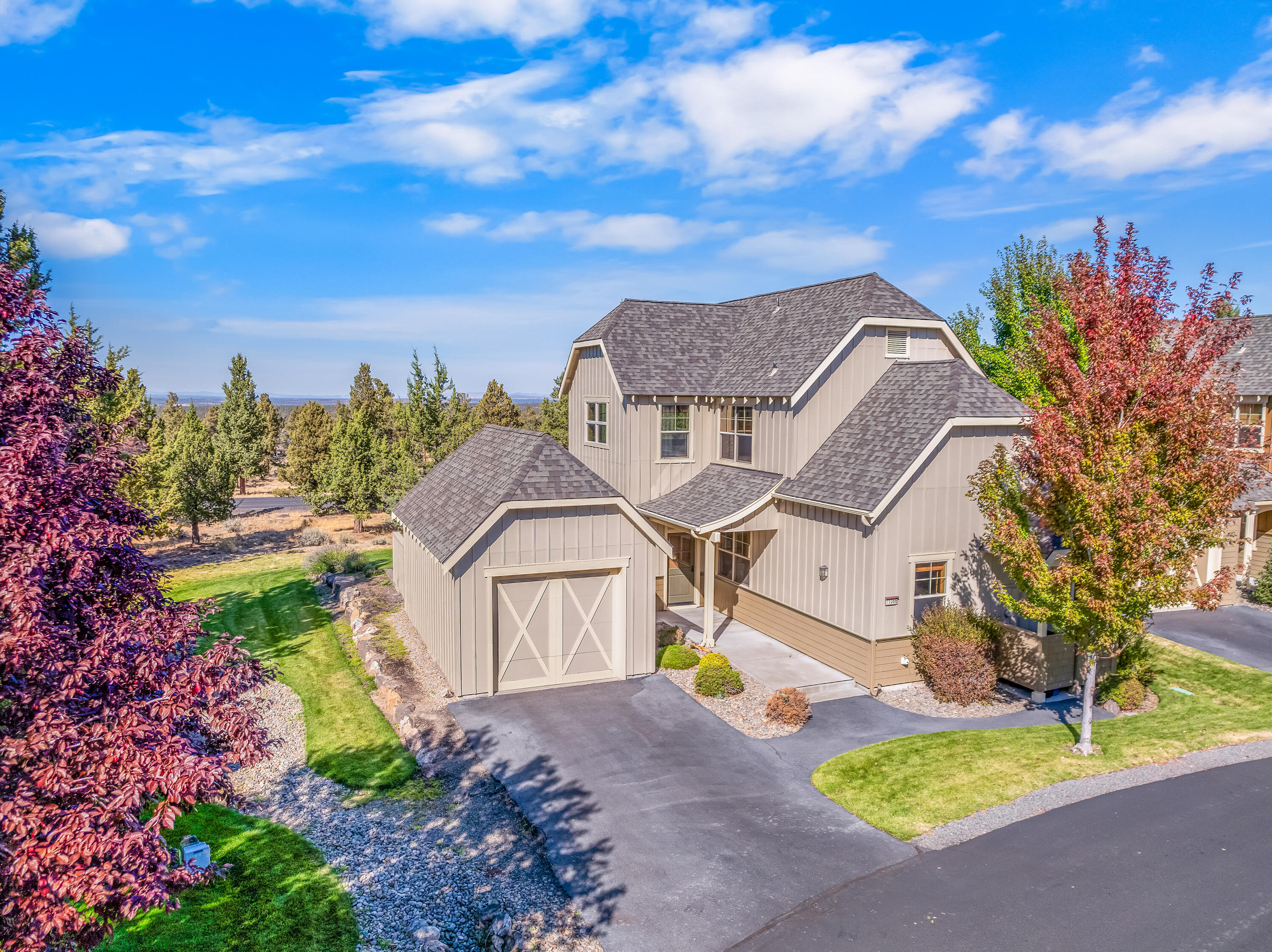 This wonderful home is situated on an exterior lot in The Ridge at Eagle Crest, with unique views of the cascade mountains and sprawling BLM beyond the common space. Exemplary craftsmanship of Sun Forest Construction boasts wood cased windows, hardwood floors, solid wood doors and cabinets throughout. This thoughtfully laid out floor plan offers a great room downstairs with a corner gas fireplace and sliding glass door to the back patio, while the living/flex room upstairs has an abundance of windows to capture the views and bring in the natural light. Primary suites on each level, and an additional powder/laundry room downstairs. Kitchen has plenty of cabinet space, granite tops, built in buffet and slate flooring. Detached, extended single garage and has an overhead storage rack and a drop down ladder with ample storage space in the attic.  And lets not forget, with this home comes all the enjoyment of the Eagle Crest Amenities! Welcome to your home in the High Desert!