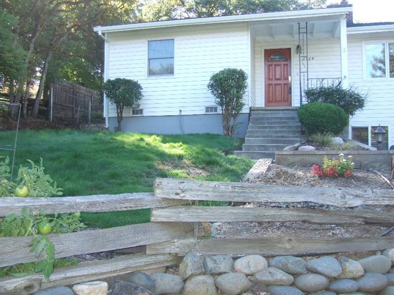Wonderful Home in Old East Medford - Tour this Old East Medford Cottage - This 4 Bedroom, 2 Bath Home is Nestled along a beautiful Tree Lined Street. Hardwood Floors - Carpeting - Custom Cabinets in Kitchen - Large .24 acre lot terraced with lawn and flower beds - Meticulously Thorough with great array of colors.